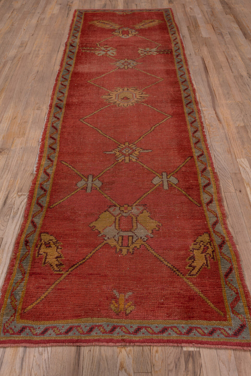 3' x 11' one-of-a-kind handmade antique Oushak runner rug. Color palette: terra cotta, rust, gold, taupe, rose, sage