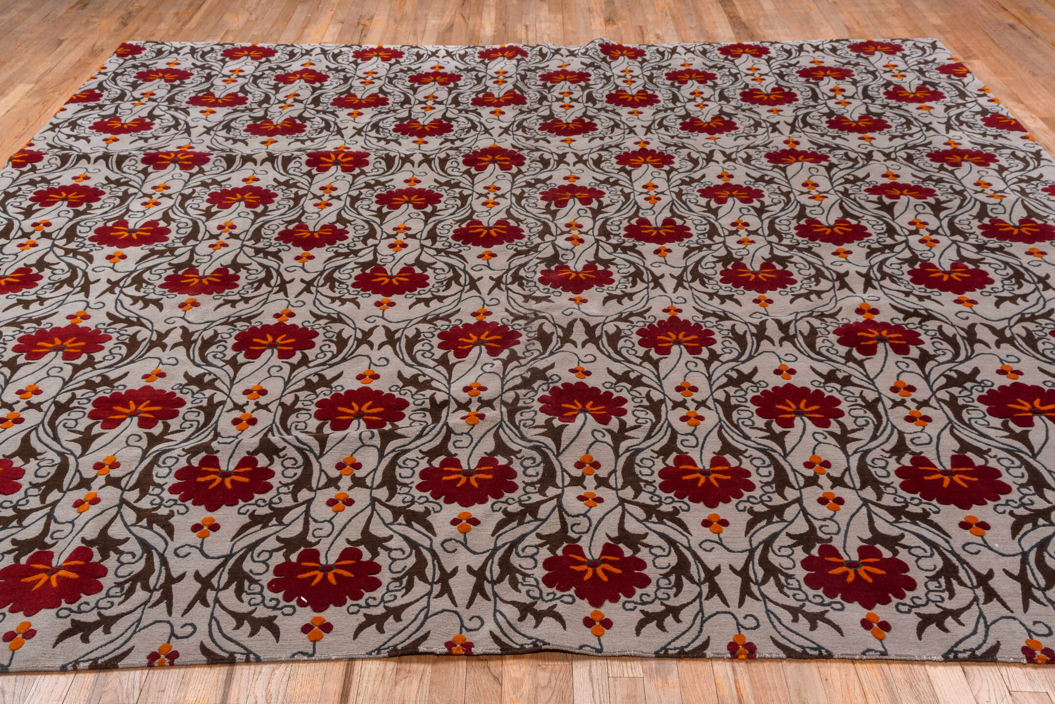 10' x 10' one-of-a-kind handmade vintage Tibetan oversize rug. Color palette: ivory, brown, crimson, rust, orange, red