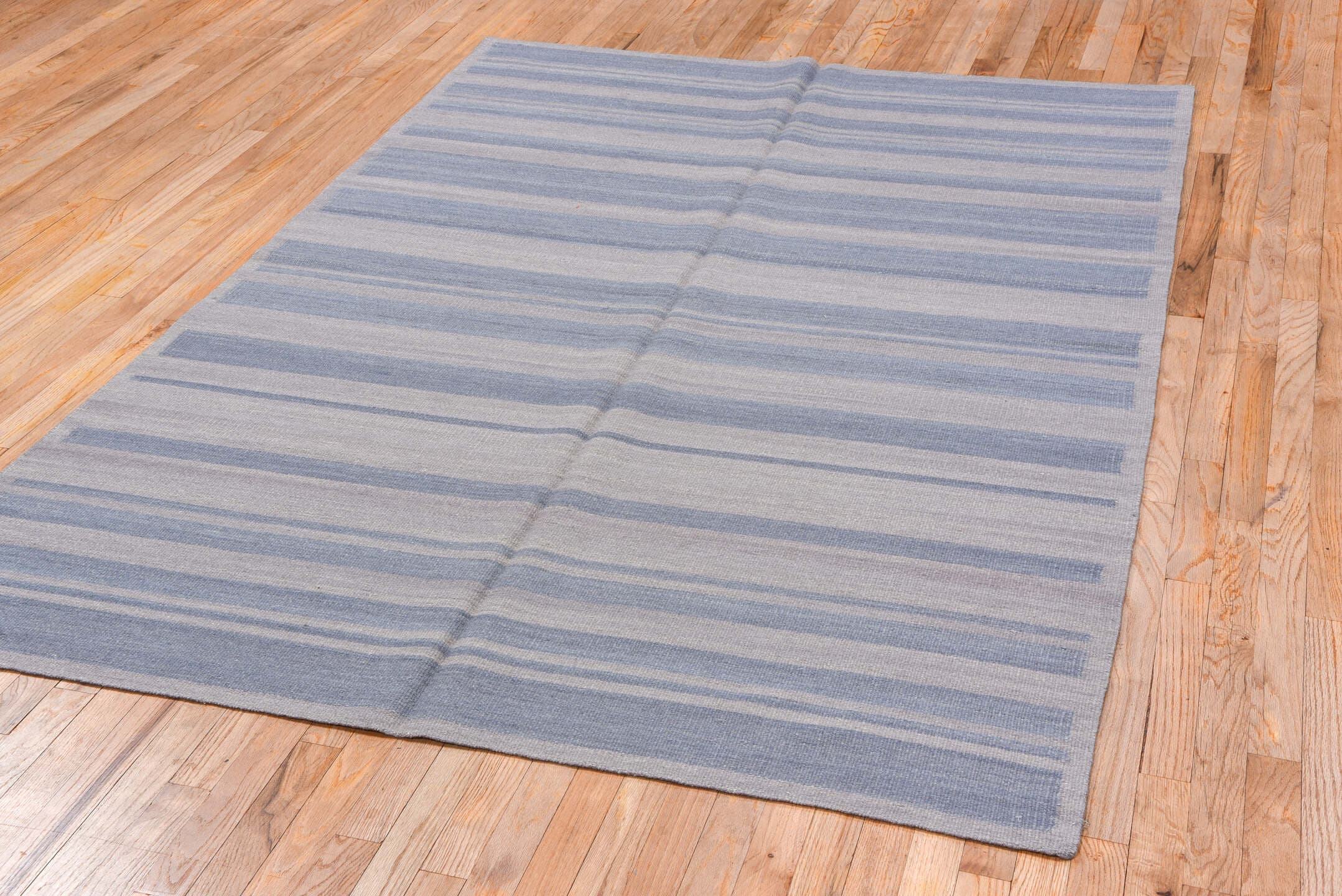 5' x 7' one-of-a-kind handmade vintage Kilim rug. Color palette: pale blue, ivory, light gray, light blue