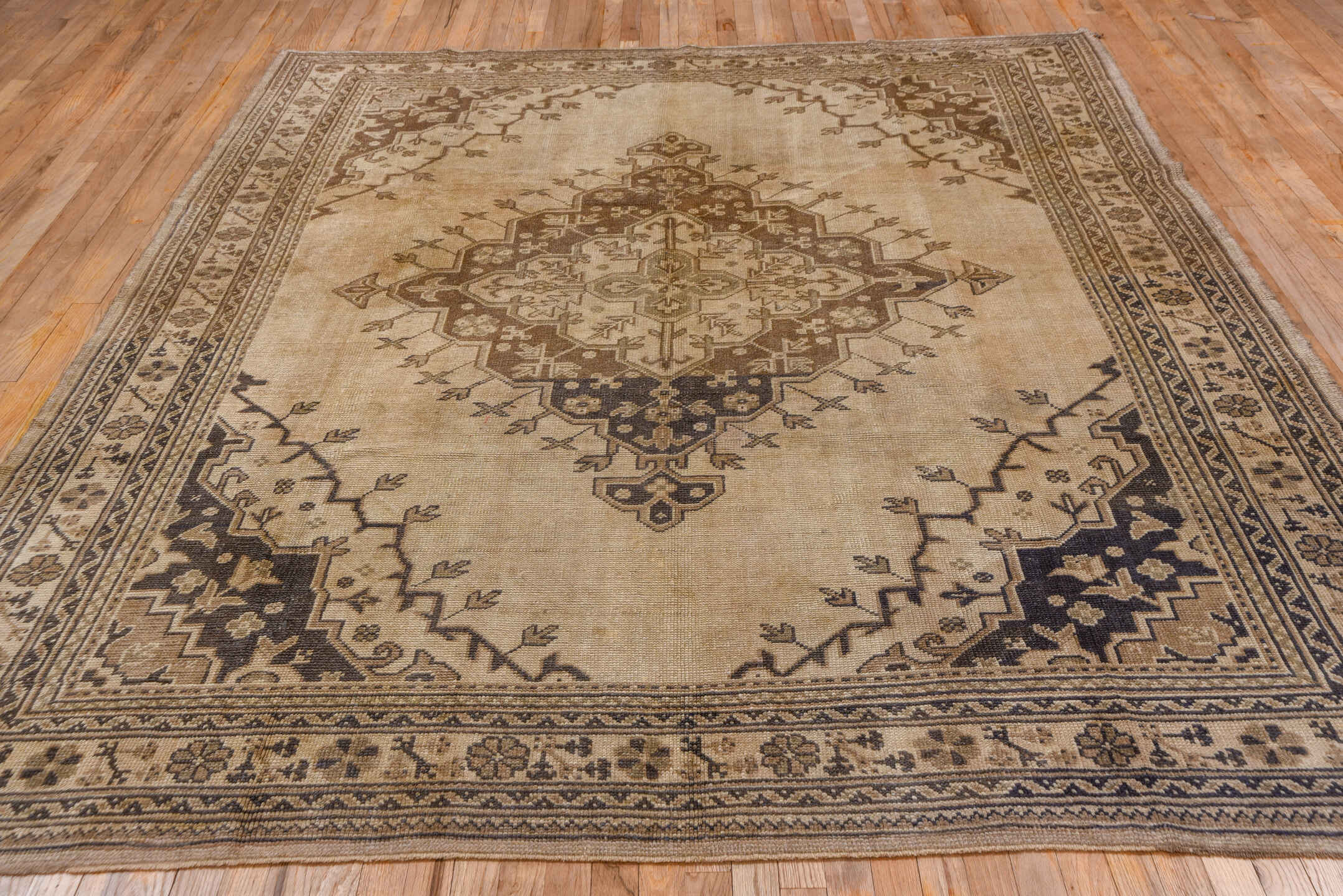 7' x 9' one-of-a-kind handmade vintage Oushak rug. Color palette: beige, taupe, brown, ivory, charcoal, gray, black