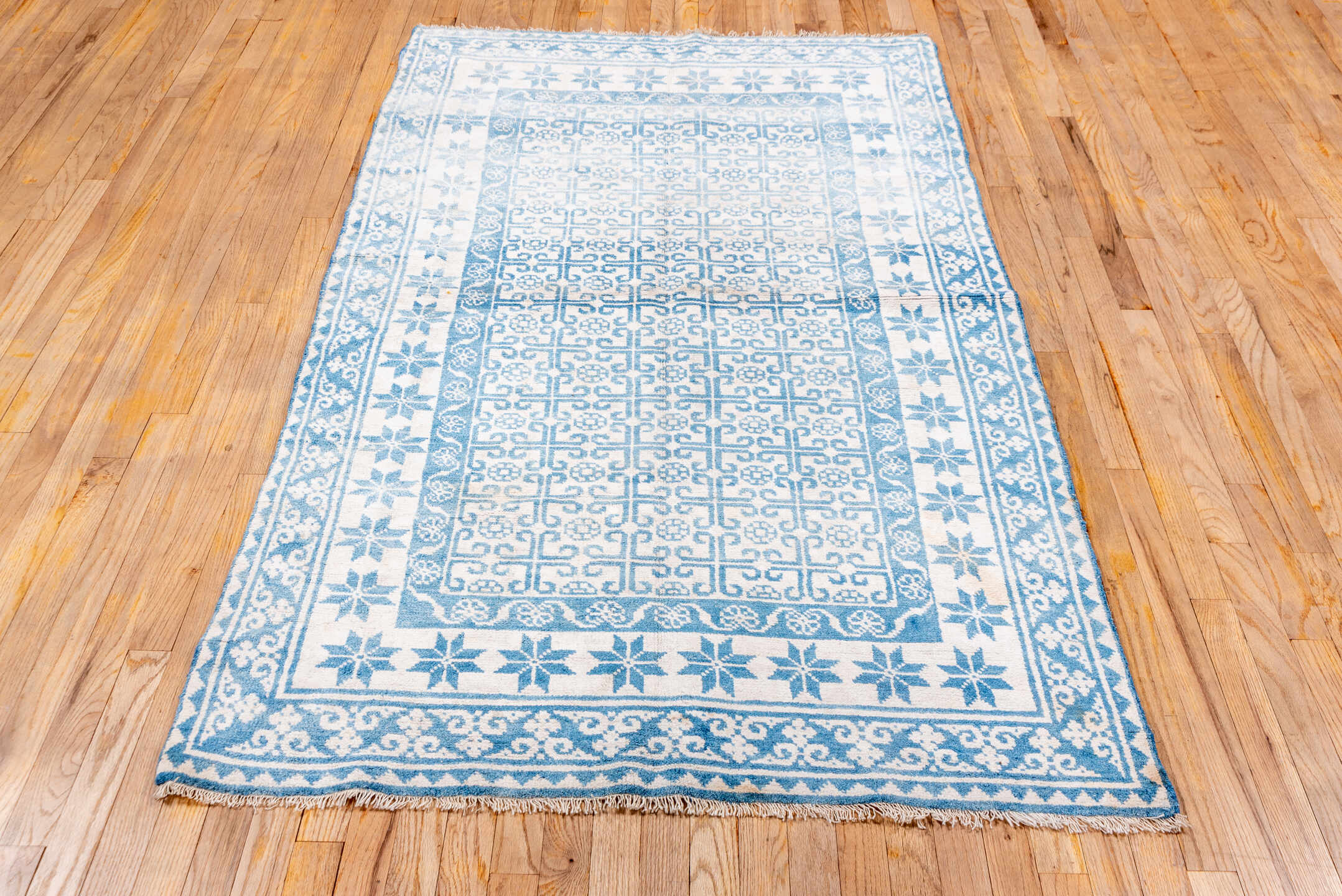 4' x 7' one-of-a-kind handmade vintage Cotton Agra rug. Color palette: ivory, sky blue, azure, slate blue, light blue