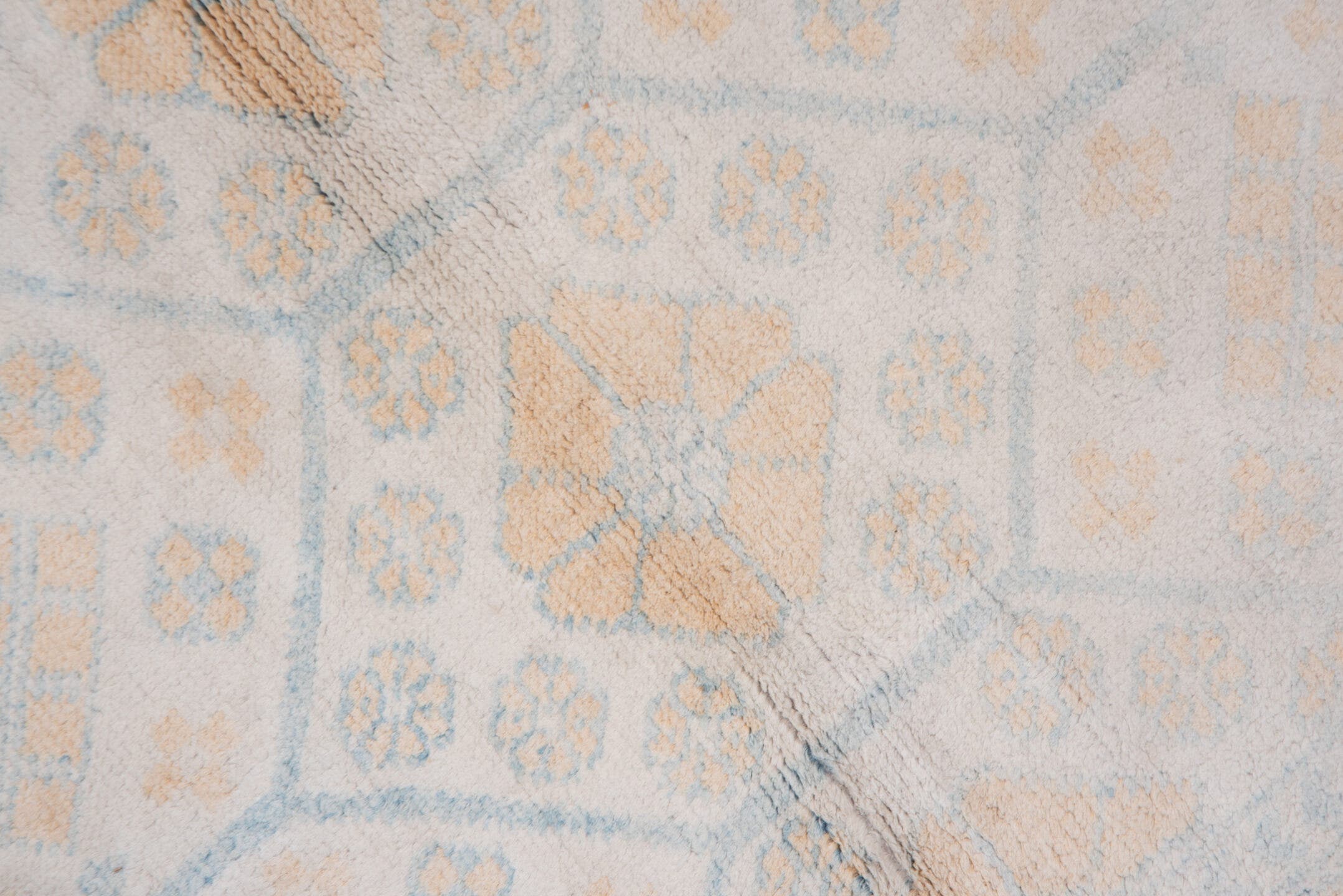 4' x 7' one-of-a-kind handmade vintage Cotton Agra rug. Color palette: ivory, pale blue, peach, sky blue, cream, taupe