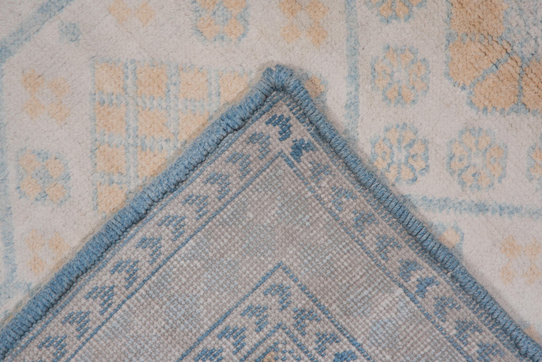 4' x 7' one-of-a-kind handmade vintage Cotton Agra rug. Color palette: ivory, pale blue, peach, sky blue, cream, taupe