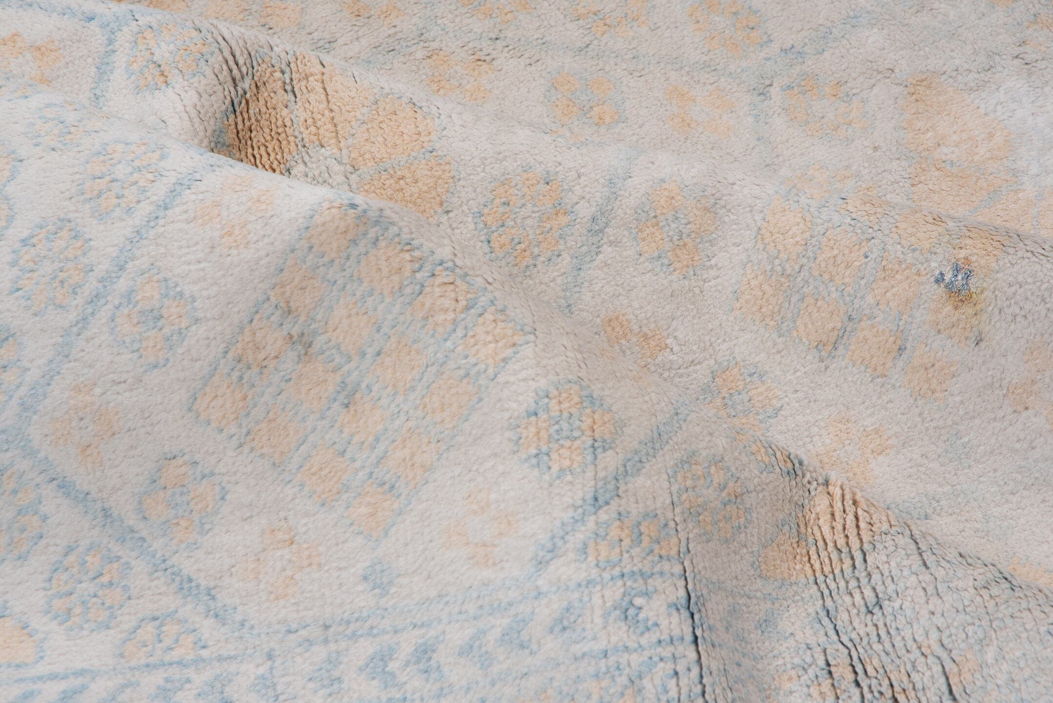 4' x 7' one-of-a-kind handmade vintage Cotton Agra rug. Color palette: ivory, pale blue, peach, sky blue, cream, taupe