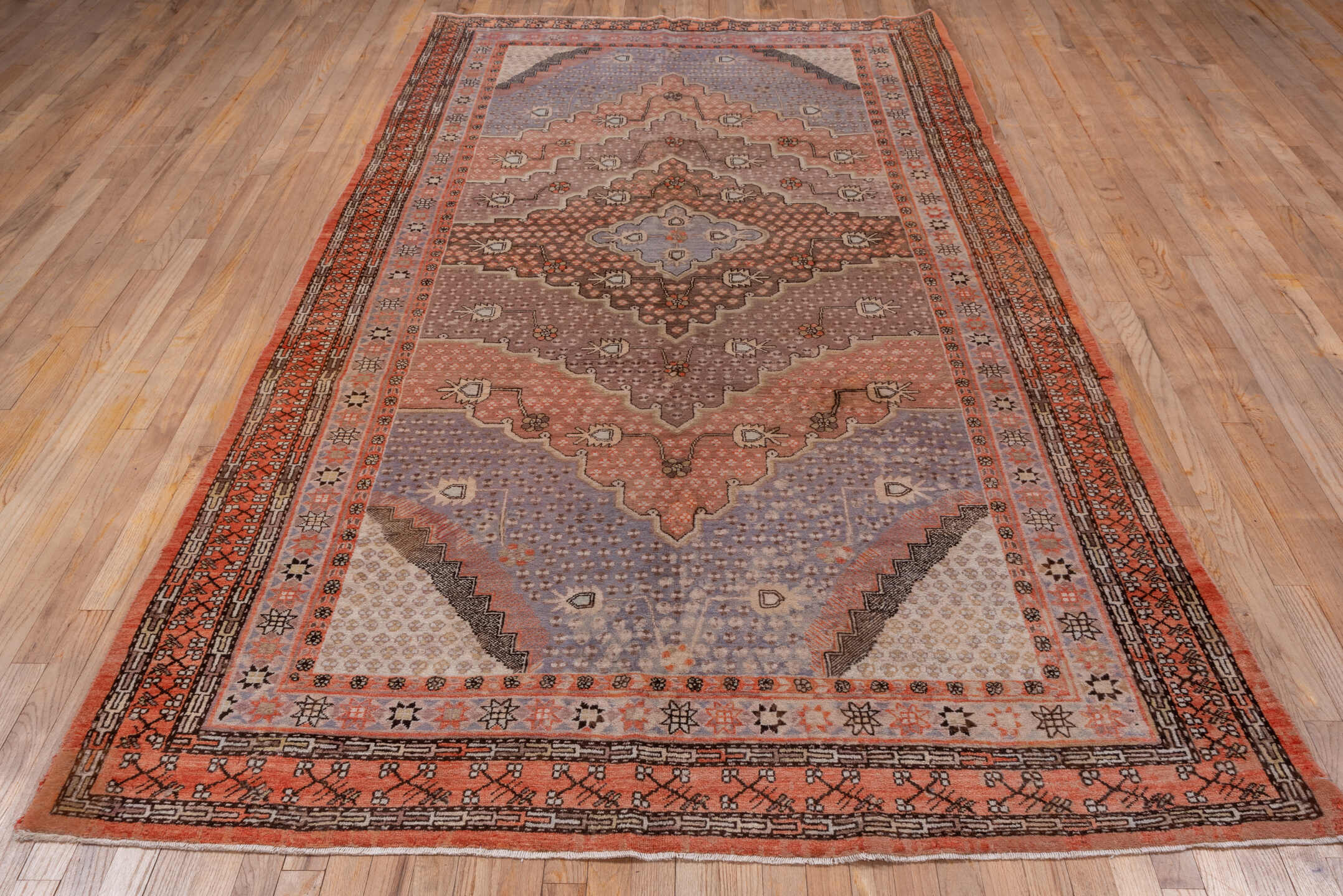 5' x 10' one-of-a-kind handmade vintage Khotan medium size rug. Color palette: brown, gray, light gray, pink, redwood
