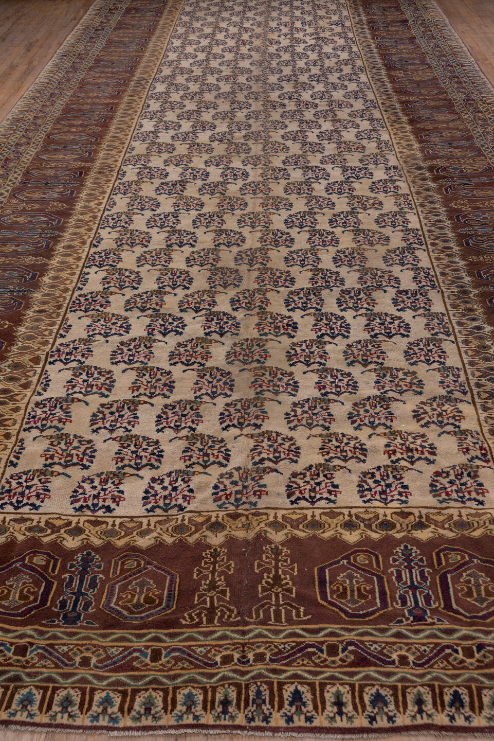 9' x 24' one-of-a-kind handmade vintage Amritzar rug. Color palette: ivory, brown, navy, taupe, rust, gold, blue, beige
