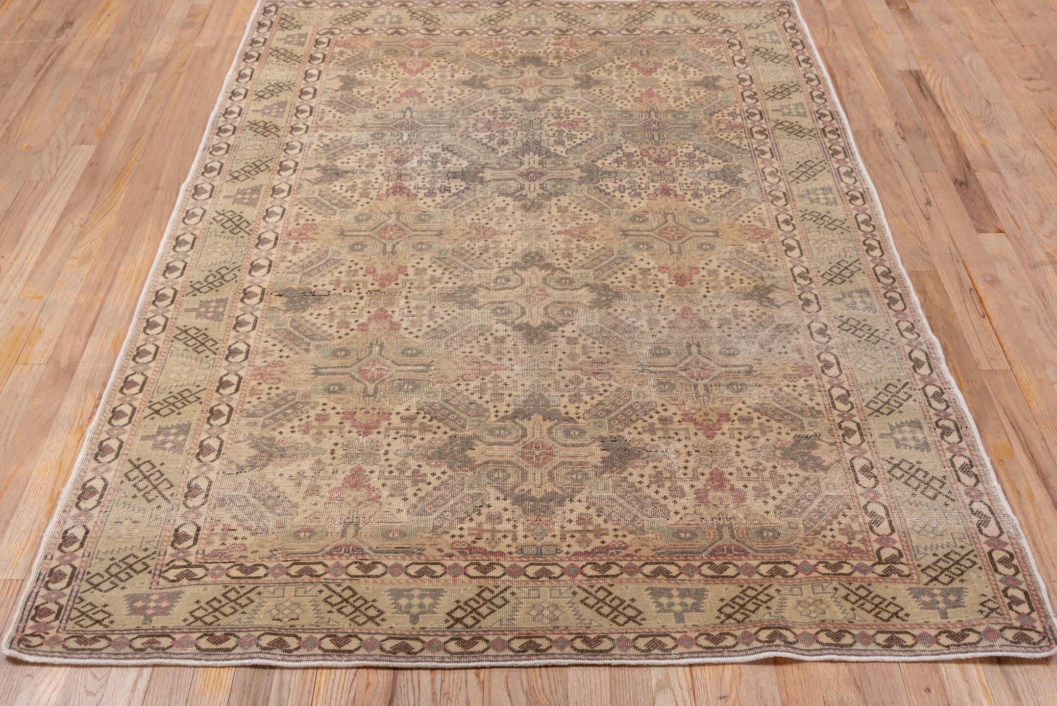 4' x 7' one-of-a-kind handmade vintage Kaisary rug. Color palette: brown, gray, pink