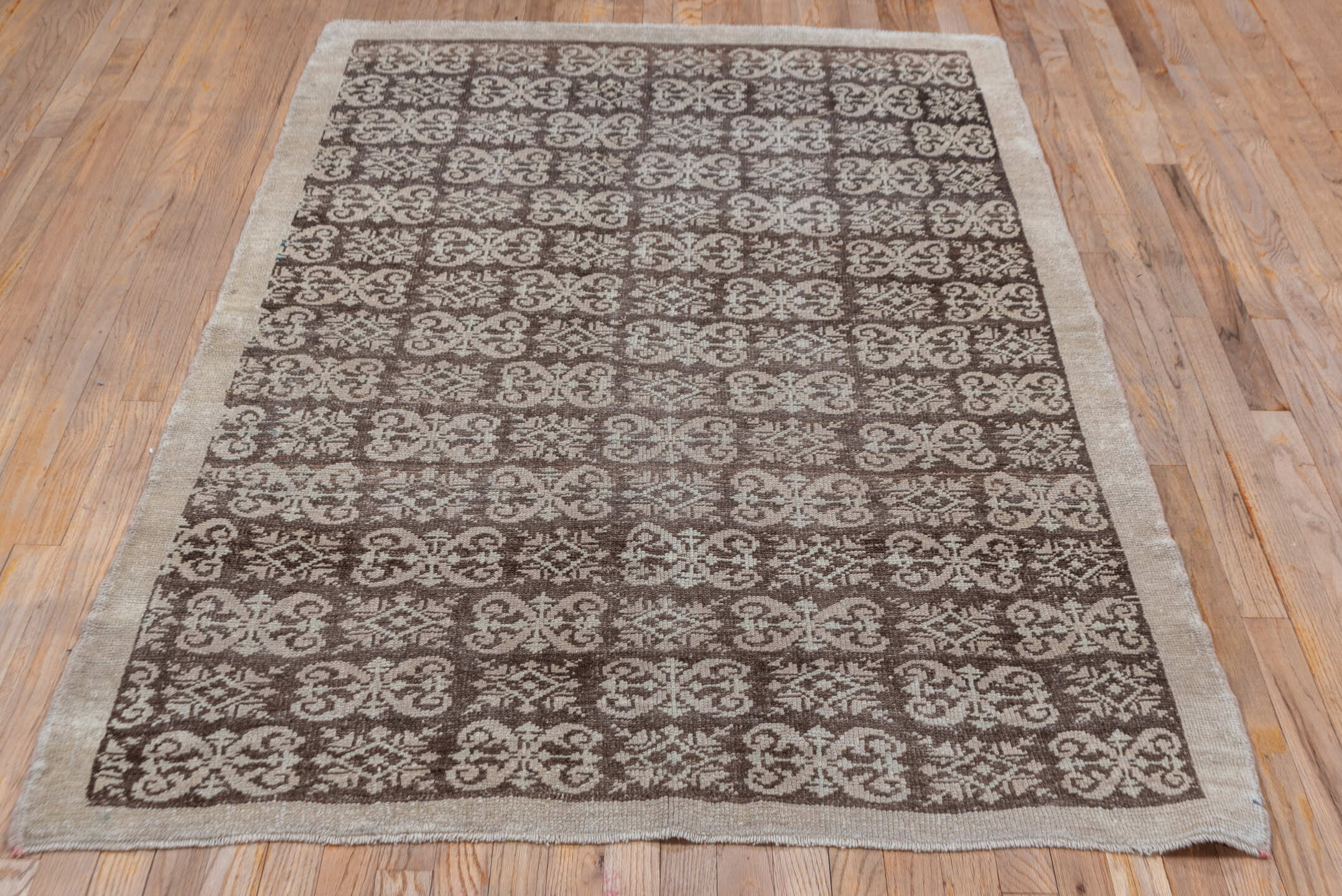 4' x 6' one-of-a-kind handmade vintage Tulu small size rug. Color palette: brown, gray, light gray, off-white, pink