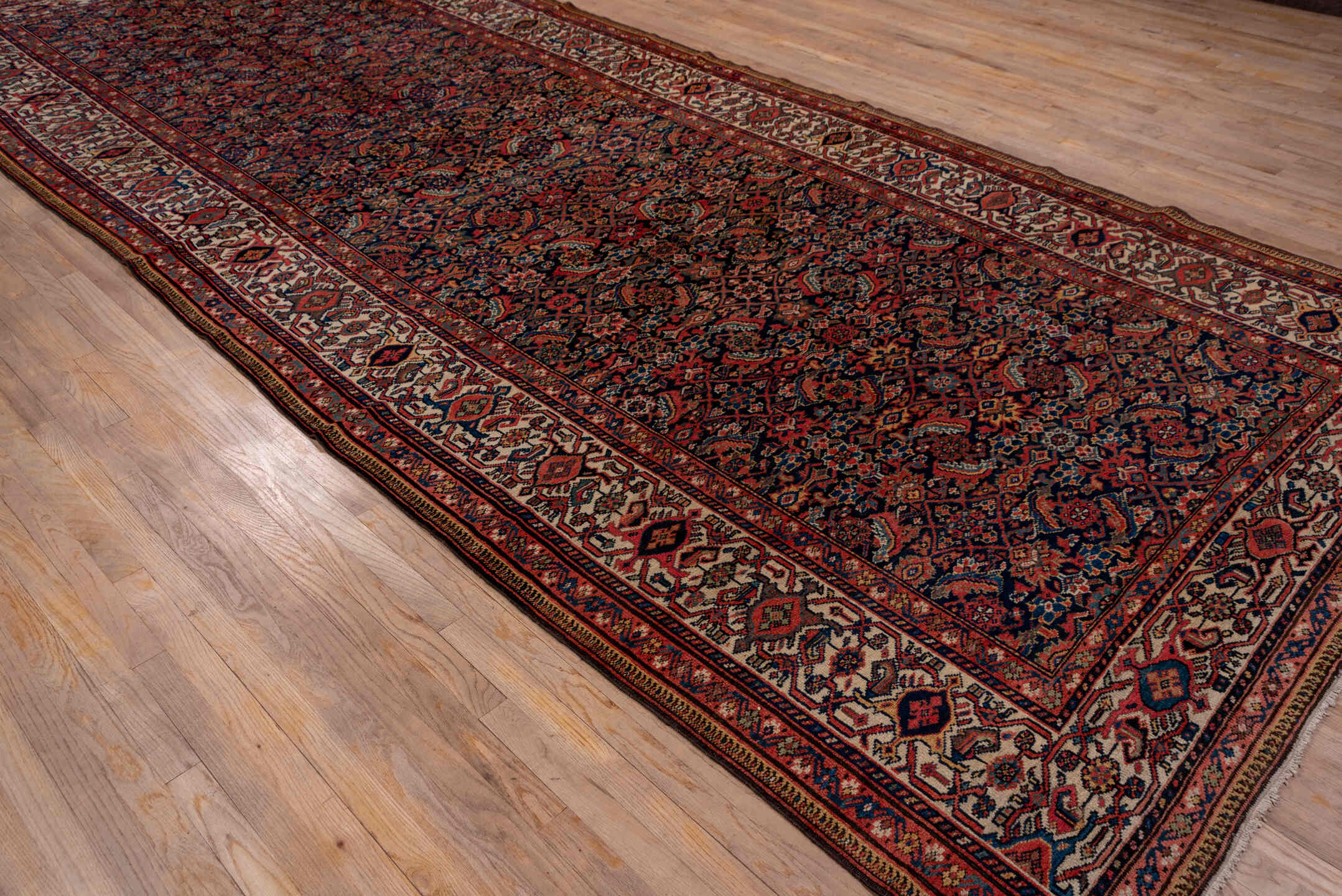 7' x 17' one-of-a-kind handmade antique Mahal rug. Color palette: navy, rust, ivory, coral, indigo, camel, burgundy, blue