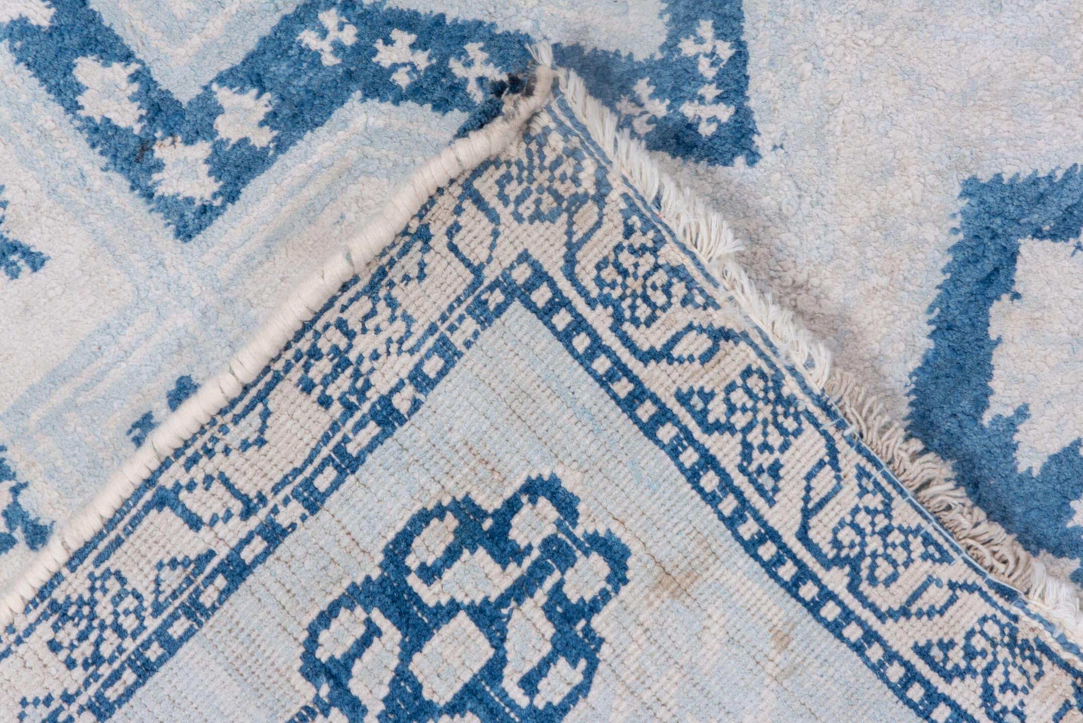 4' x 7' one-of-a-kind handmade vintage Cotton Agra rug. Color palette: ivory, sky blue, powder blue, denim blue, light blue