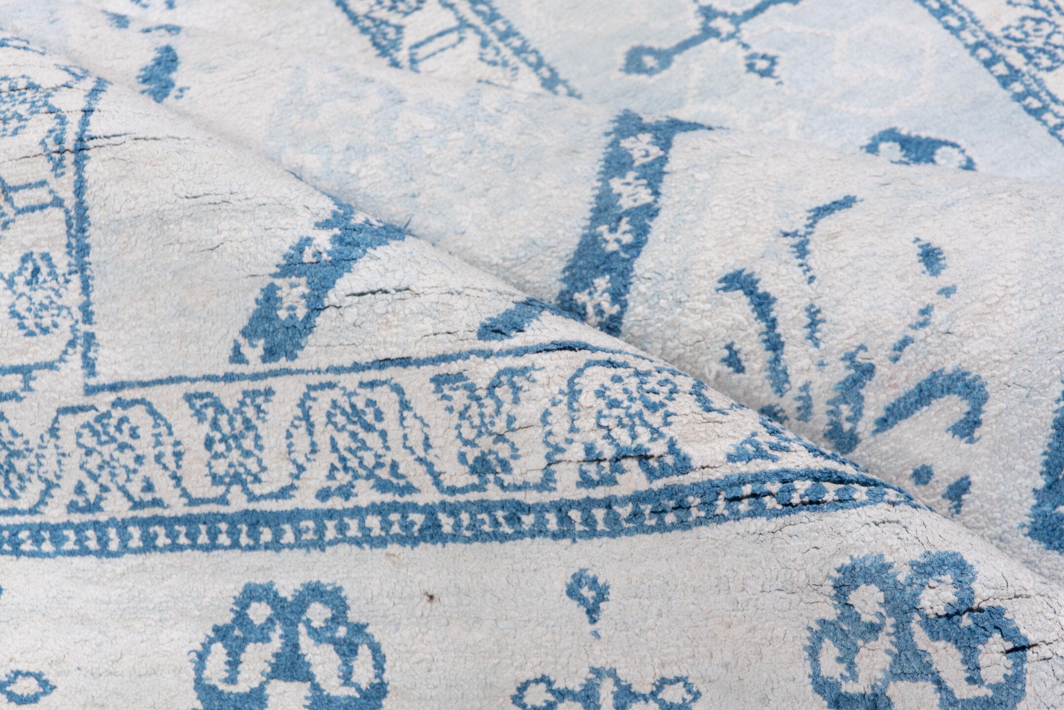 4' x 7' one-of-a-kind handmade vintage Cotton Agra rug. Color palette: ivory, sky blue, powder blue, denim blue, light blue