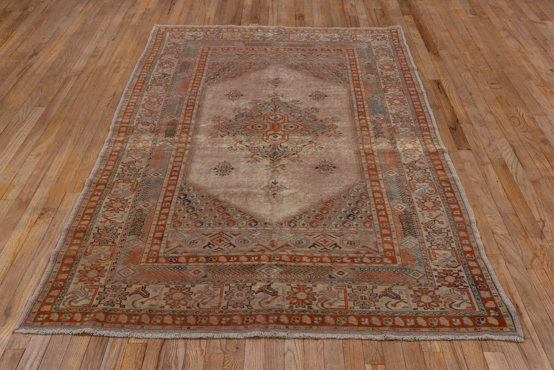5' x 8' one-of-a-kind handmade vintage Oushak medium size rug. Color palette: brown, gray, light gray, off-white, pink