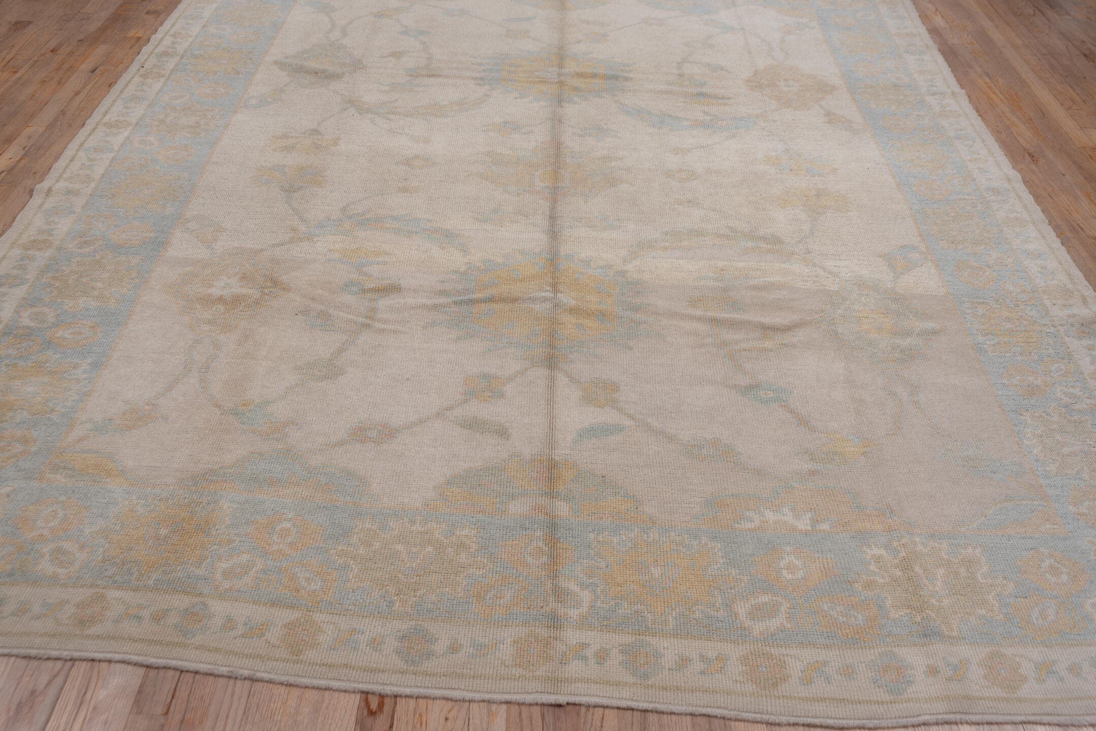9' x 12' one-of-a-kind handmade vintage Oushak large size rug. Color palette: ivory, pale blue, taupe, gold, beige, sage
