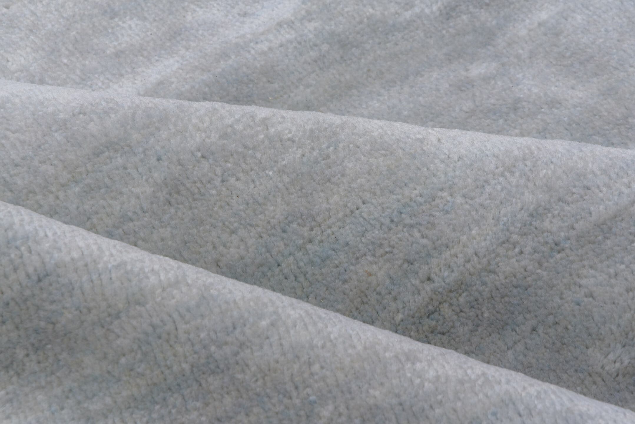 9' x 12' one-of-a-kind handmade vintage Rad large size rug. Color palette: ivory, pale blue, cream, taupe, light blue, beige