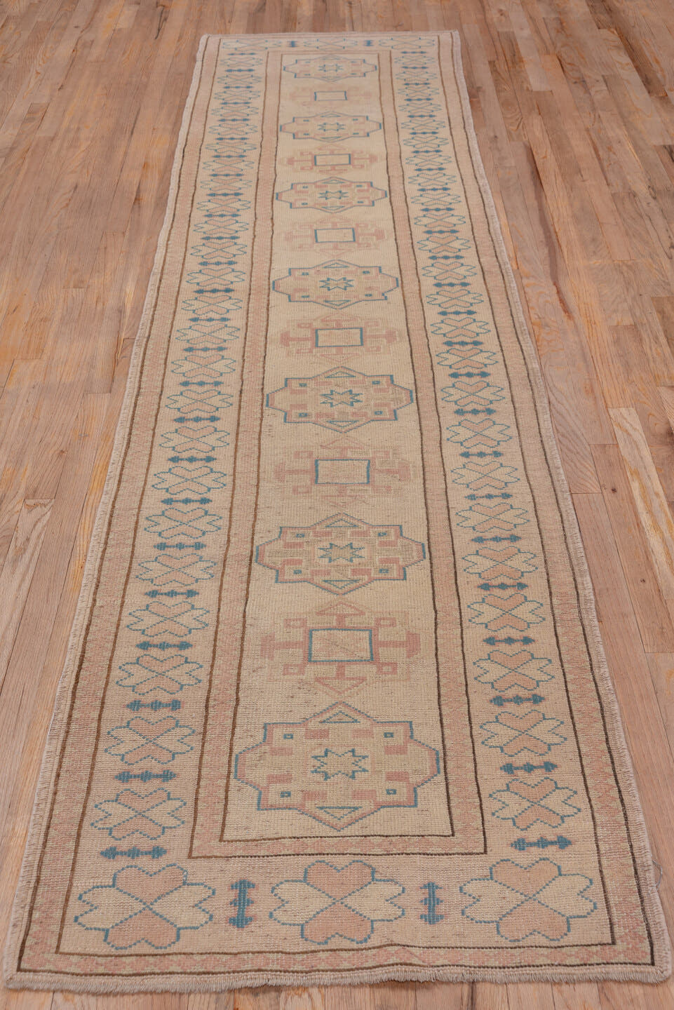 2' x 11' one-of-a-kind handmade vintage Oushak runner rug. Color palette: blush, ivory, pale blue, taupe, dusty rose, pink