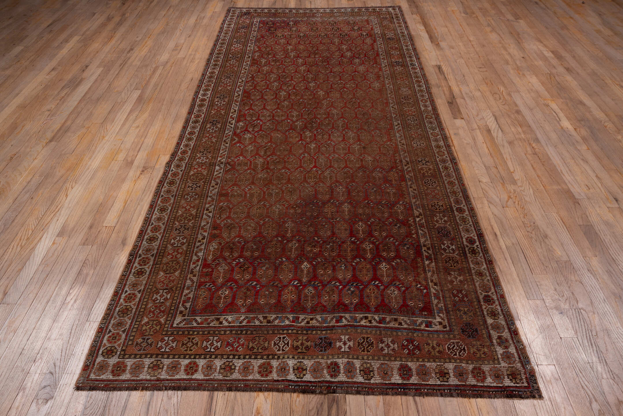 5' x 11' one-of-a-kind handmade vintage Shiraz runner rug. Color palette: rust, brown, ivory, burgundy, taupe, charcoal