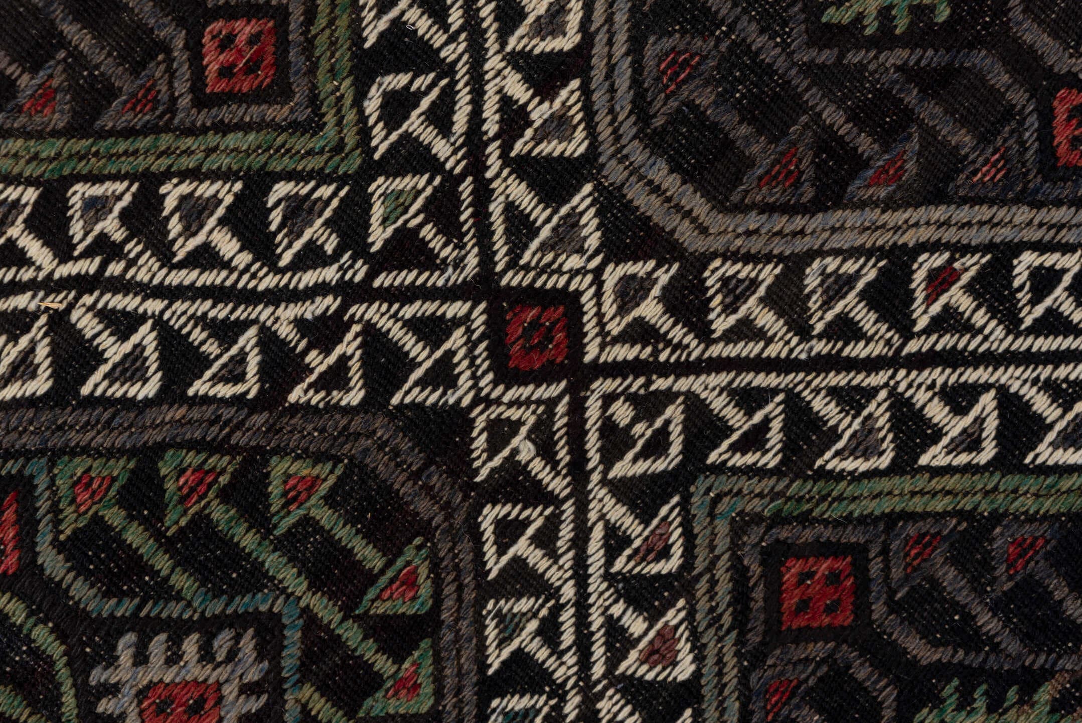 4' x 8' one-of-a-kind handmade vintage Jijim rug. Color palette: charcoal, ivory, rust, olive, taupe, rose, slate, gray