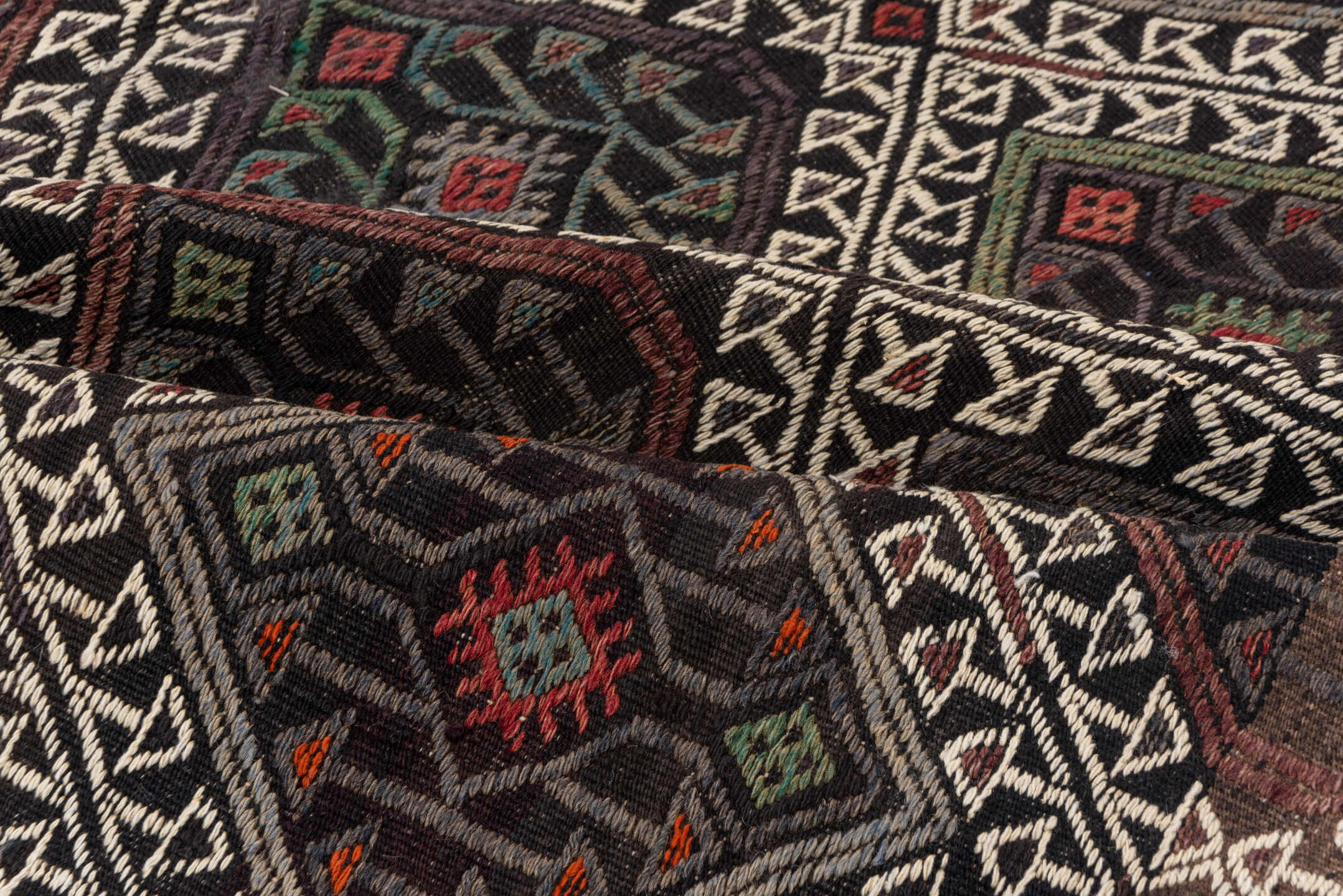 4' x 8' one-of-a-kind handmade vintage Jijim rug. Color palette: charcoal, ivory, rust, olive, taupe, rose, slate, gray