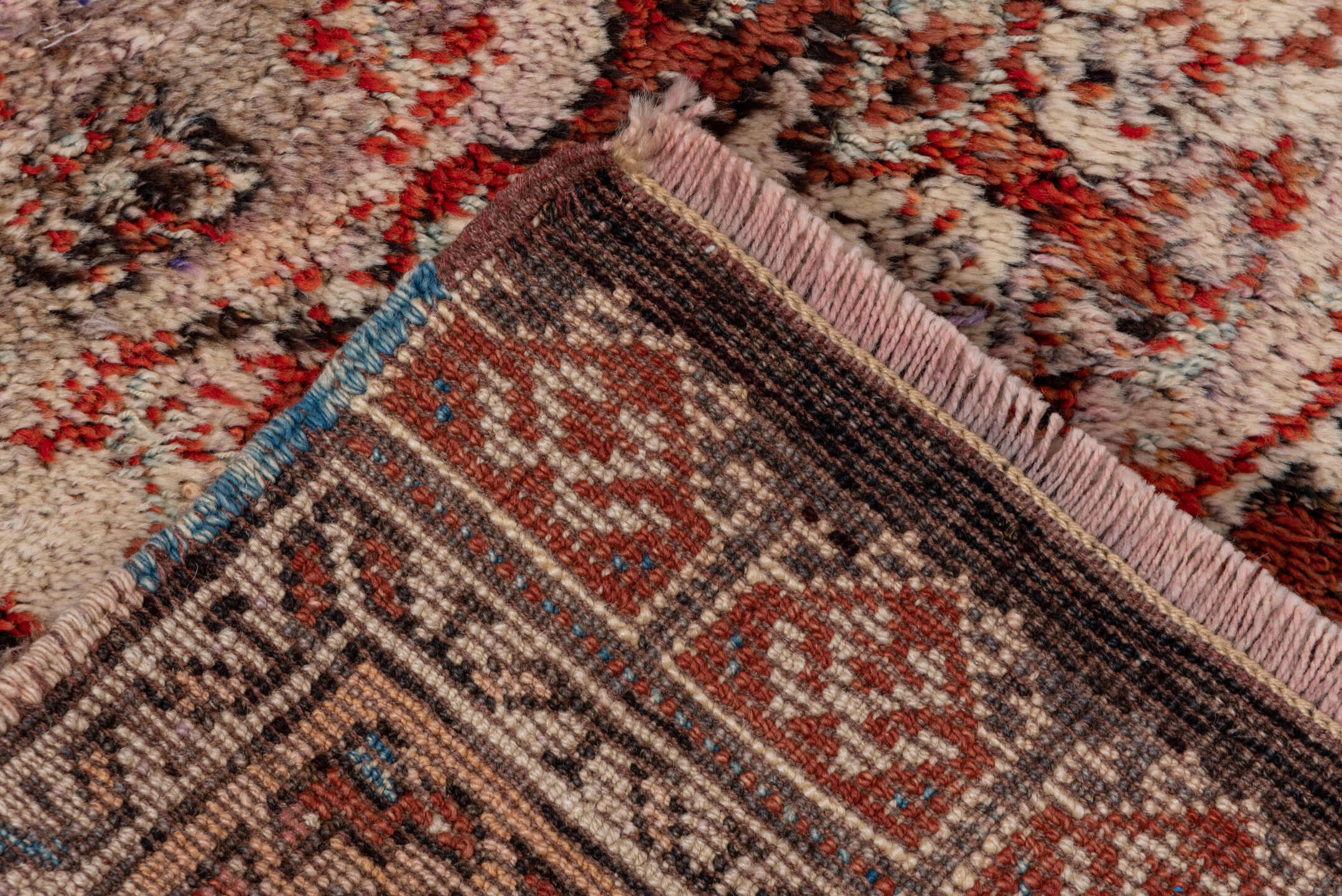4' x 5' one-of-a-kind handmade vintage Tulu small size rug. Color palette: brown, gray, light gray, off-white, pink, red