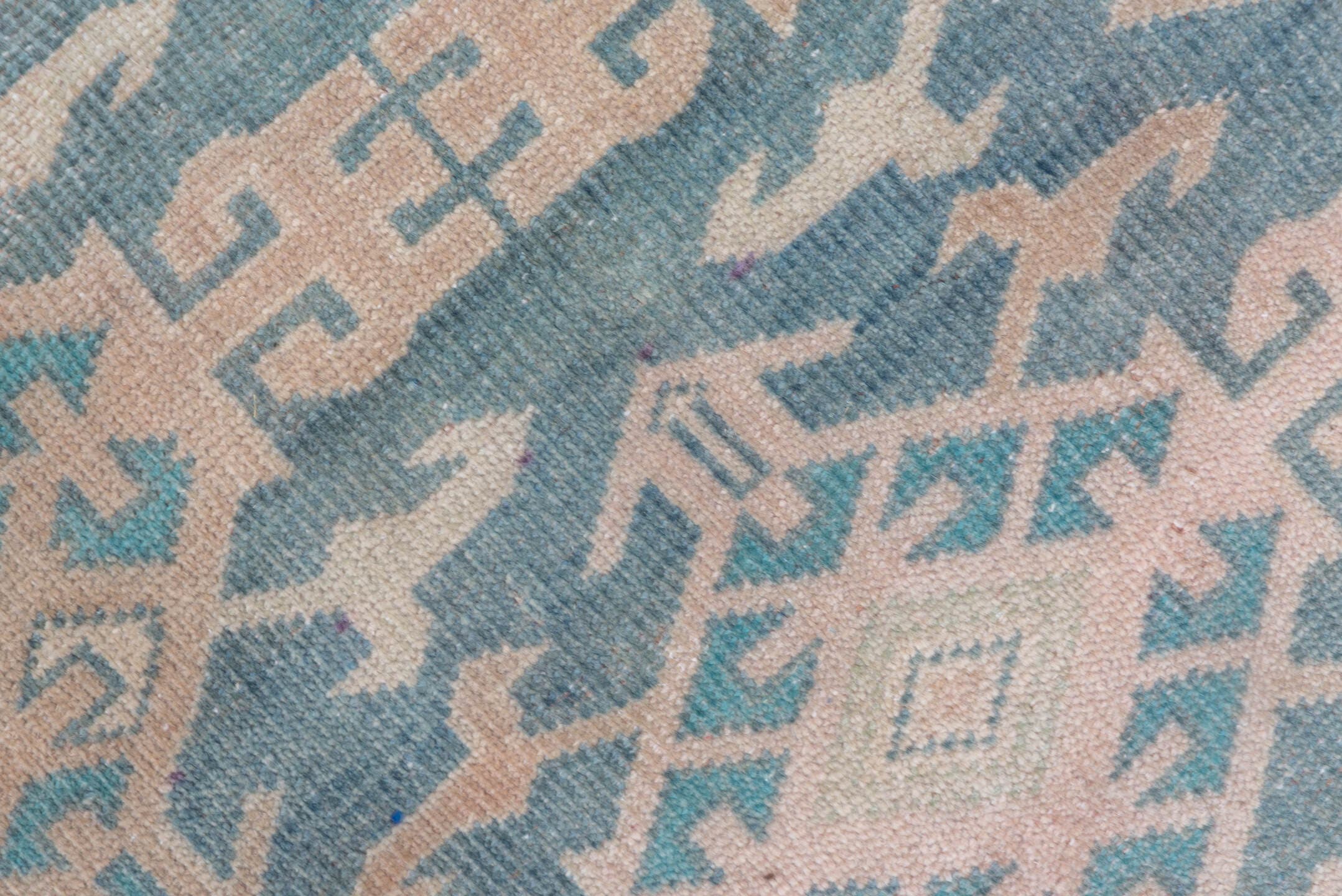 4' x 11' one-of-a-kind handmade vintage Oushak runner rug. Color palette: blue, blush, ivory, taupe, sage, pink, beige, gray