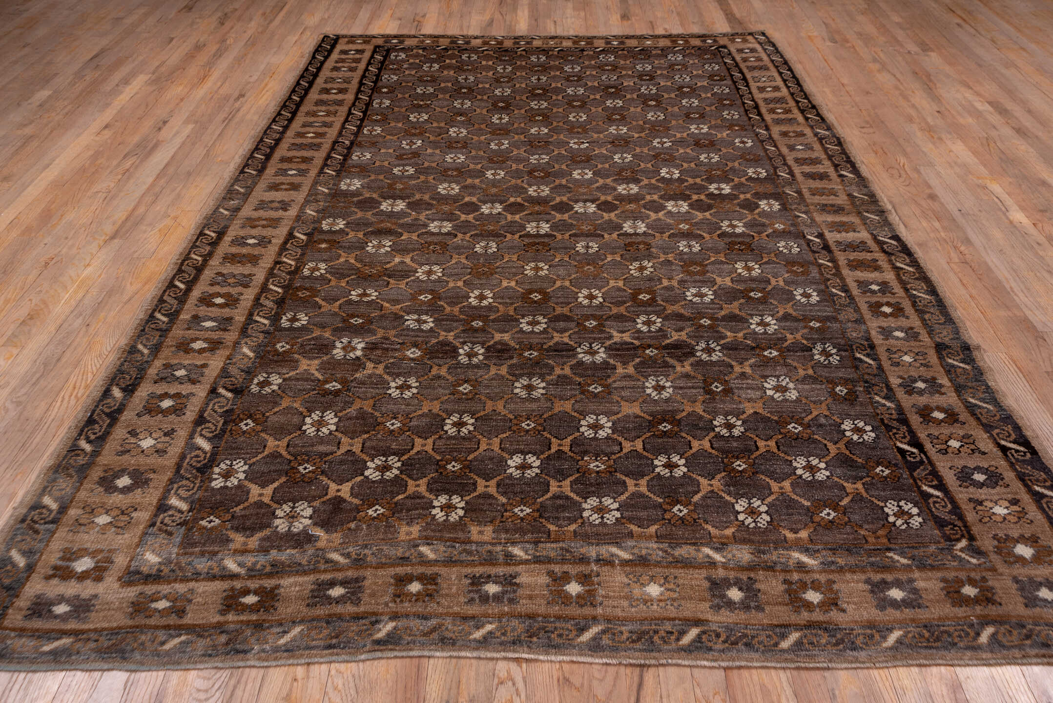 7' x 11' one-of-a-kind handmade antique Kars large size rug. Color palette: taupe, brown, camel, ivory, charcoal, beige