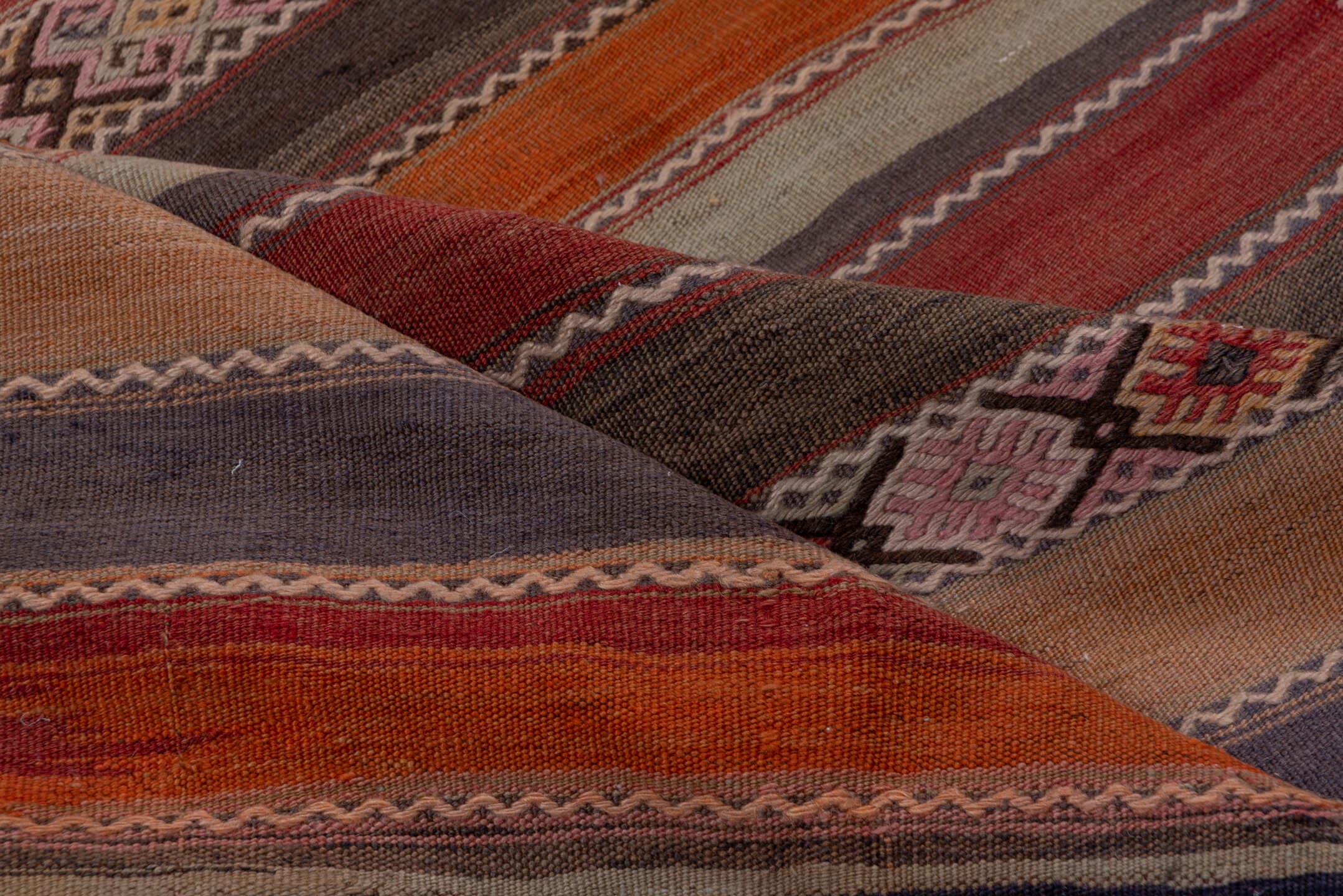 4' x 10' one-of-a-kind handmade vintage Jijim runner rug. Color palette: rust, rose, taupe, brown, charcoal, terracotta