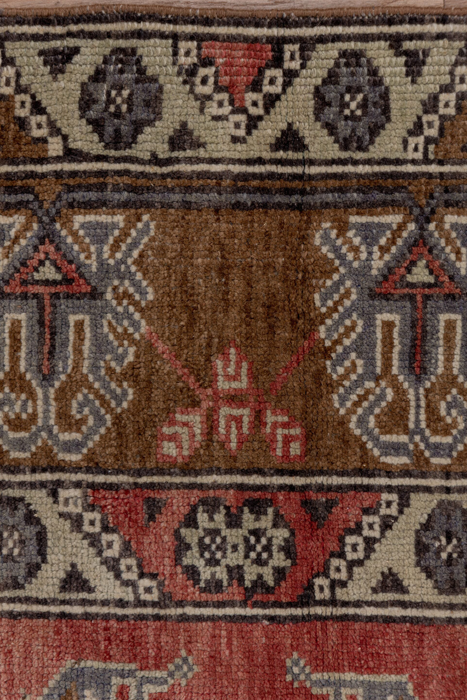 4' x 8' one-of-a-kind handmade vintage Konya runner rug. Color palette: brown, gray, pink, red