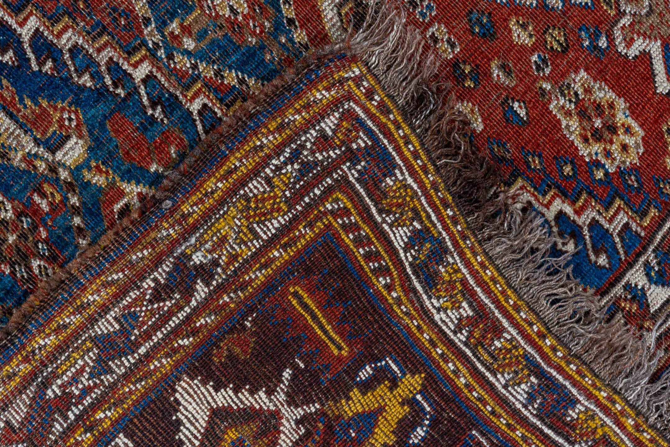 5' x 9' one-of-a-kind handmade antique Qashqai medium size rug. Color palette: rust, indigo, ivory, walnut, camel, navy