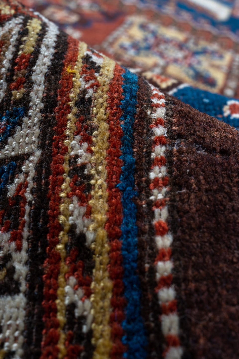 5' x 9' one-of-a-kind handmade antique Qashqai medium size rug. Color palette: rust, indigo, ivory, walnut, camel, navy