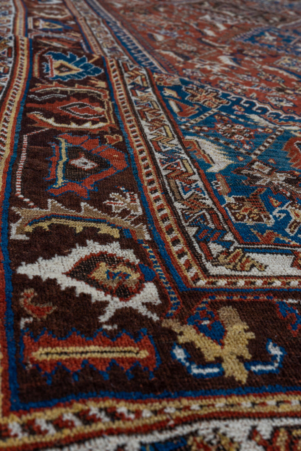 5' x 9' one-of-a-kind handmade antique Qashqai medium size rug. Color palette: rust, indigo, ivory, walnut, camel, navy