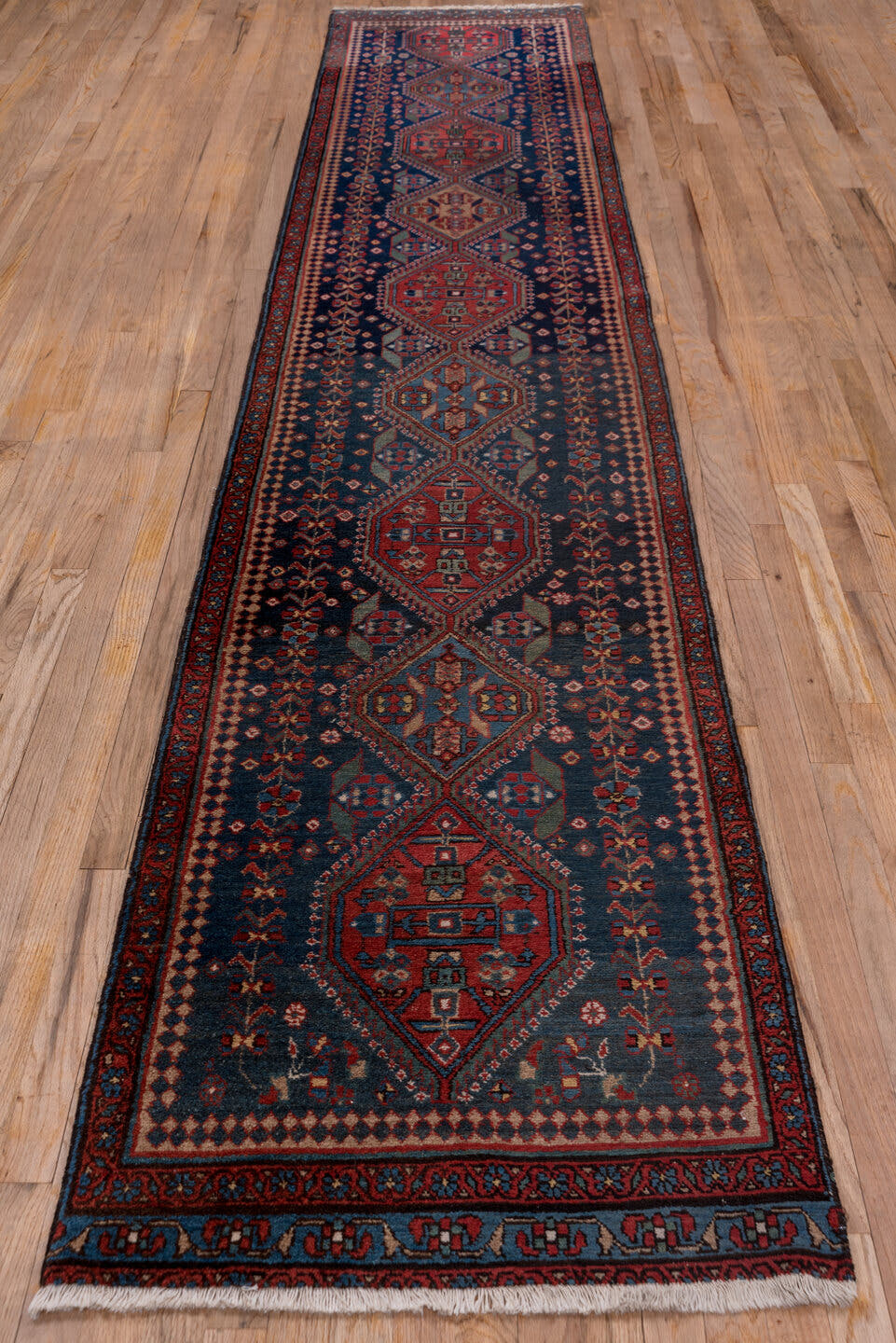 2' x 13' one-of-a-kind handmade antique Heriz runner rug. Color palette: navy, rust, brick, ivory, sky_blue, crimson, slate