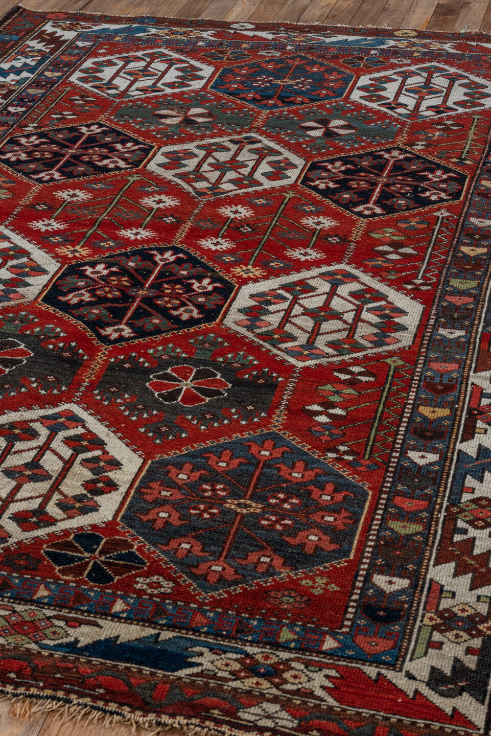 4' x 6' one-of-a-kind handmade antique Baktiary small size rug. Color palette: rust, ivory, navy, slate, burgundy, camel