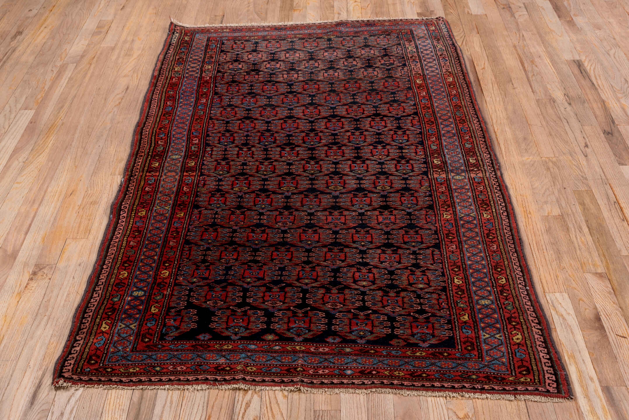 3' x 6' one-of-a-kind handmade vintage Kurd small size rug. Color palette: blue, brown, gray, off-white, pink, red, snow