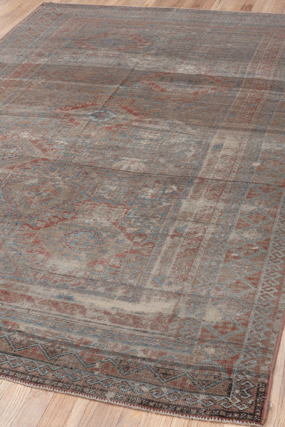 5' x 10' one-of-a-kind handmade vintage Belouch runner rug. Color palette: taupe, ivory, sky blue, rust, brown, camel