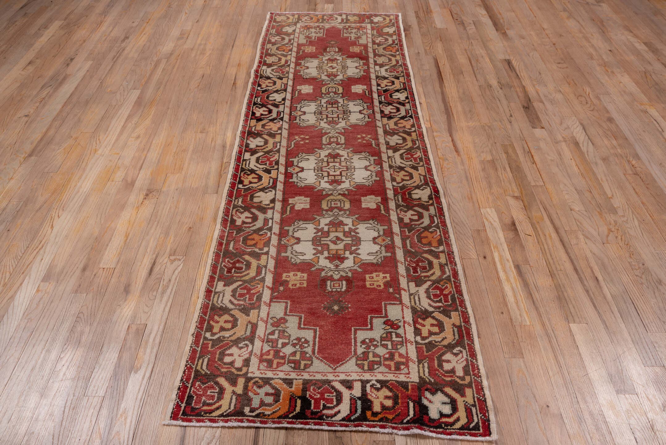 2' x 9' one-of-a-kind handmade vintage Oushak runner rug. Color palette: rust, ivory, charcoal, terra cotta, camel, rose