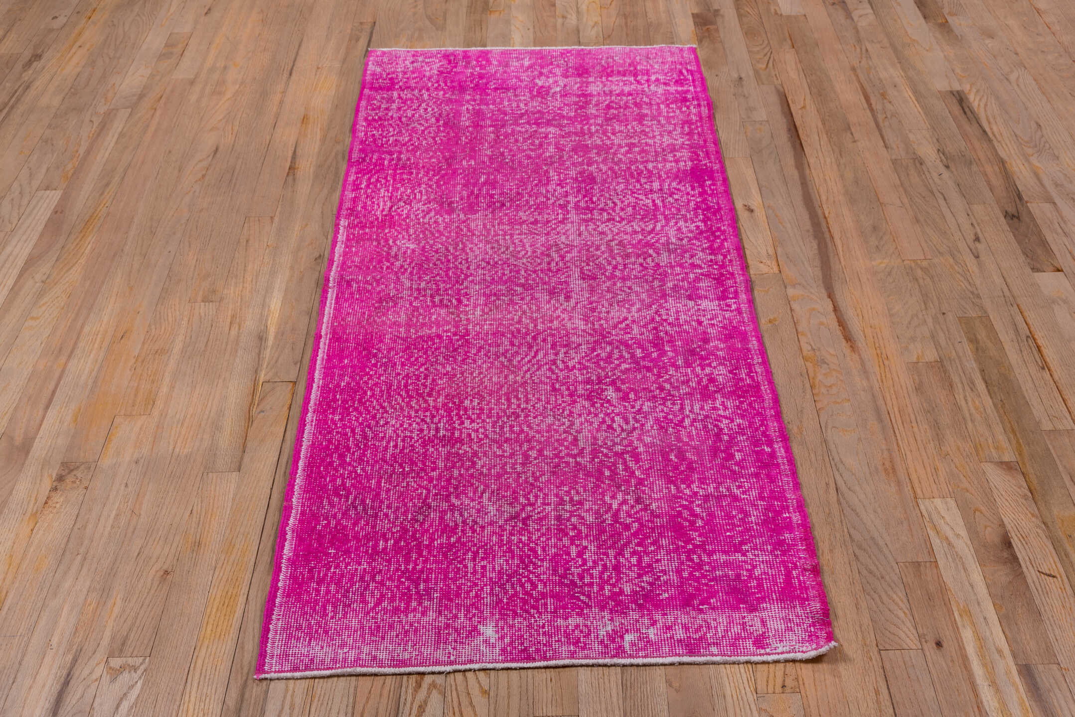 2' x 6' one-of-a-kind handmade vintage Overdyed runner rug. Color palette: fuchsia, magenta, rose, ivory, pink, red