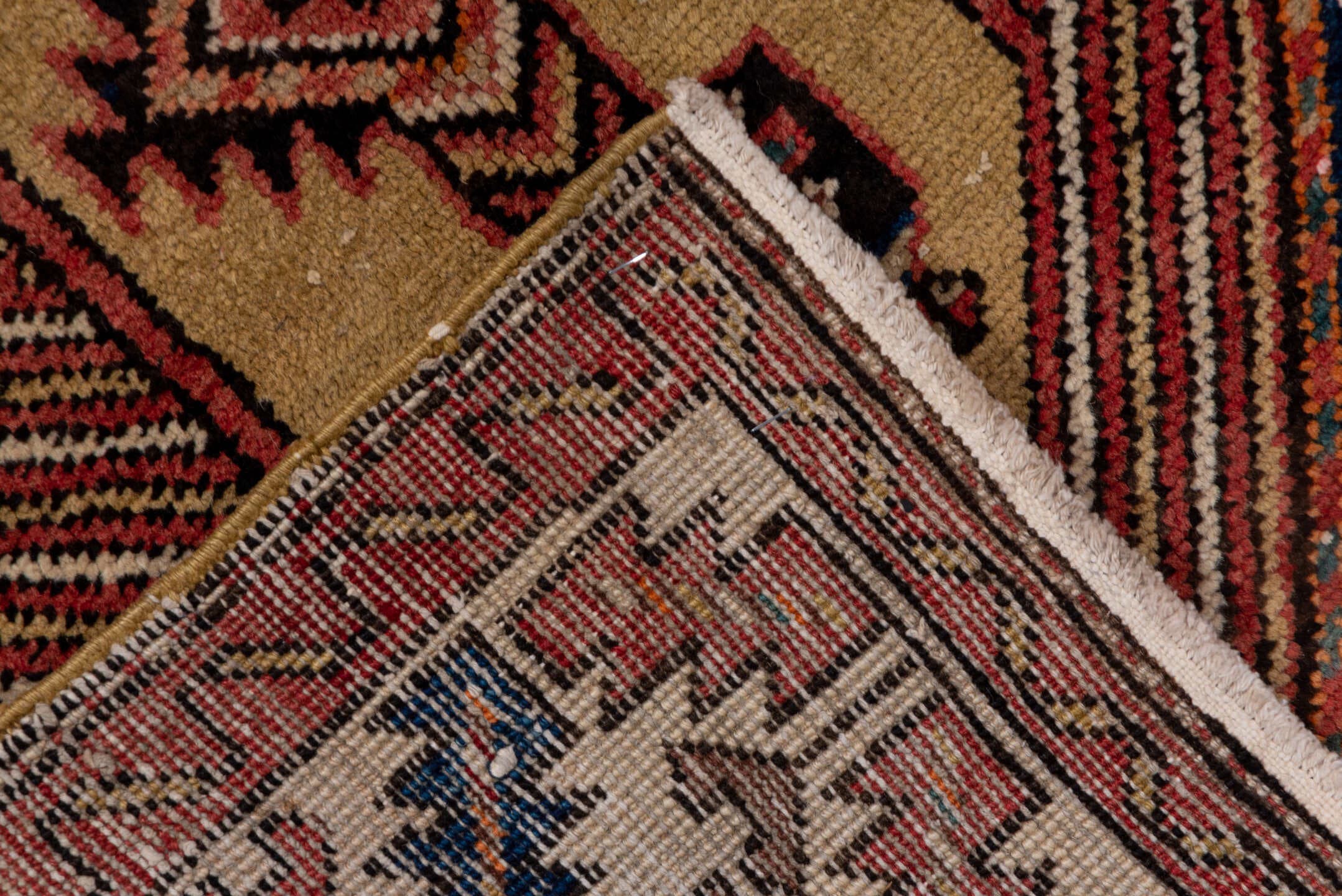 4' x 11' one-of-a-kind handmade antique Sarab runner rug. Color palette: rust, ivory, brick, navy, camel, burgundy