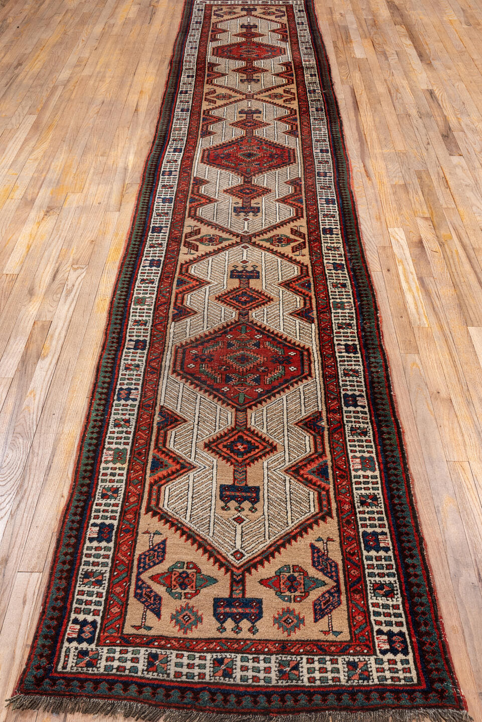 2' x 14' one-of-a-kind handmade vintage Sarab runner rug. Color palette: ivory, rust, navy, camel, crimson, charcoal