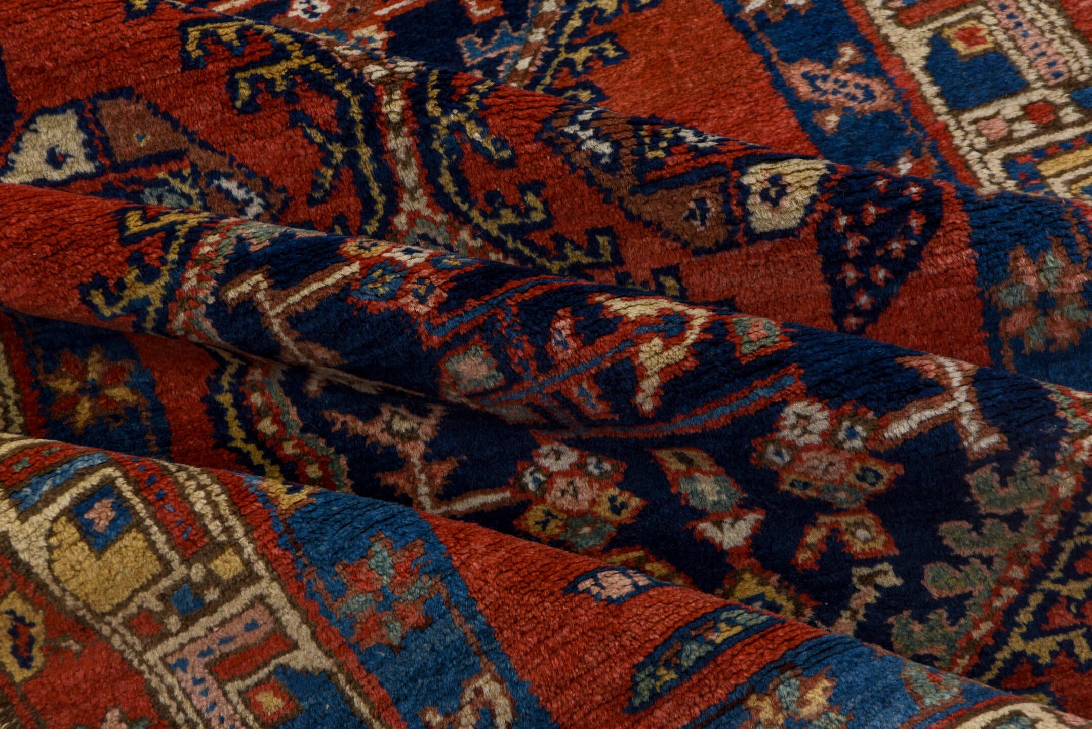 3' x 9' one-of-a-kind handmade vintage Heriz runner rug. Color palette: rust, navy, ivory, cobalt, camel, rose, terracotta