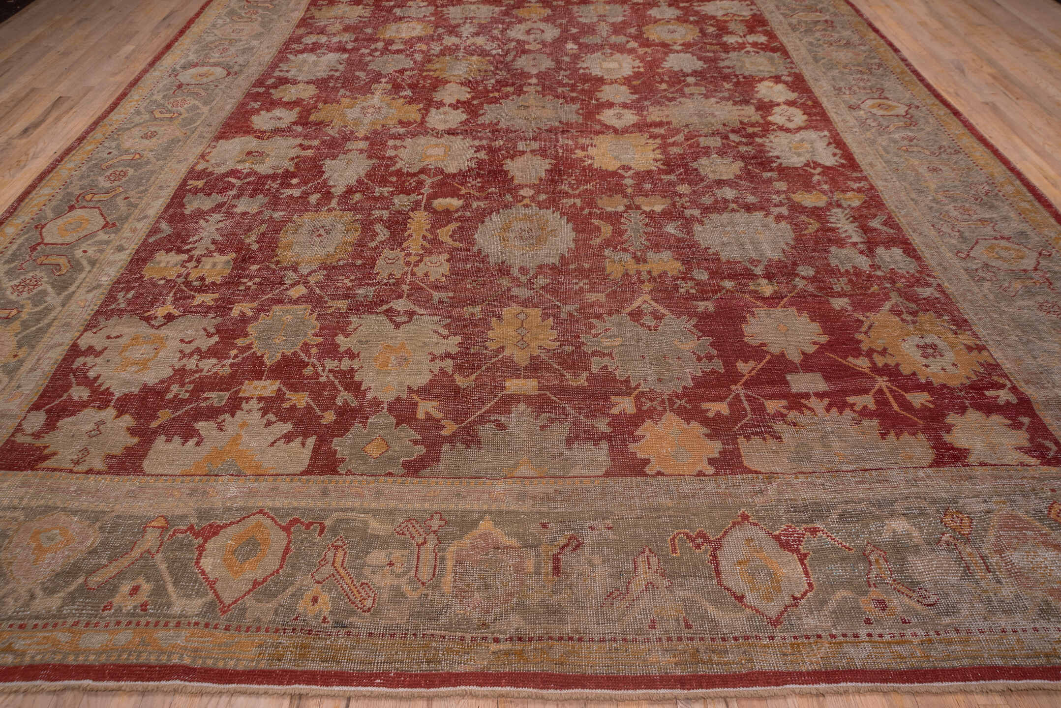 12' x 15' one-of-a-kind handmade antique Oushak oversize rug. Color palette: rust, taupe, ivory, sage, gold, terra cotta