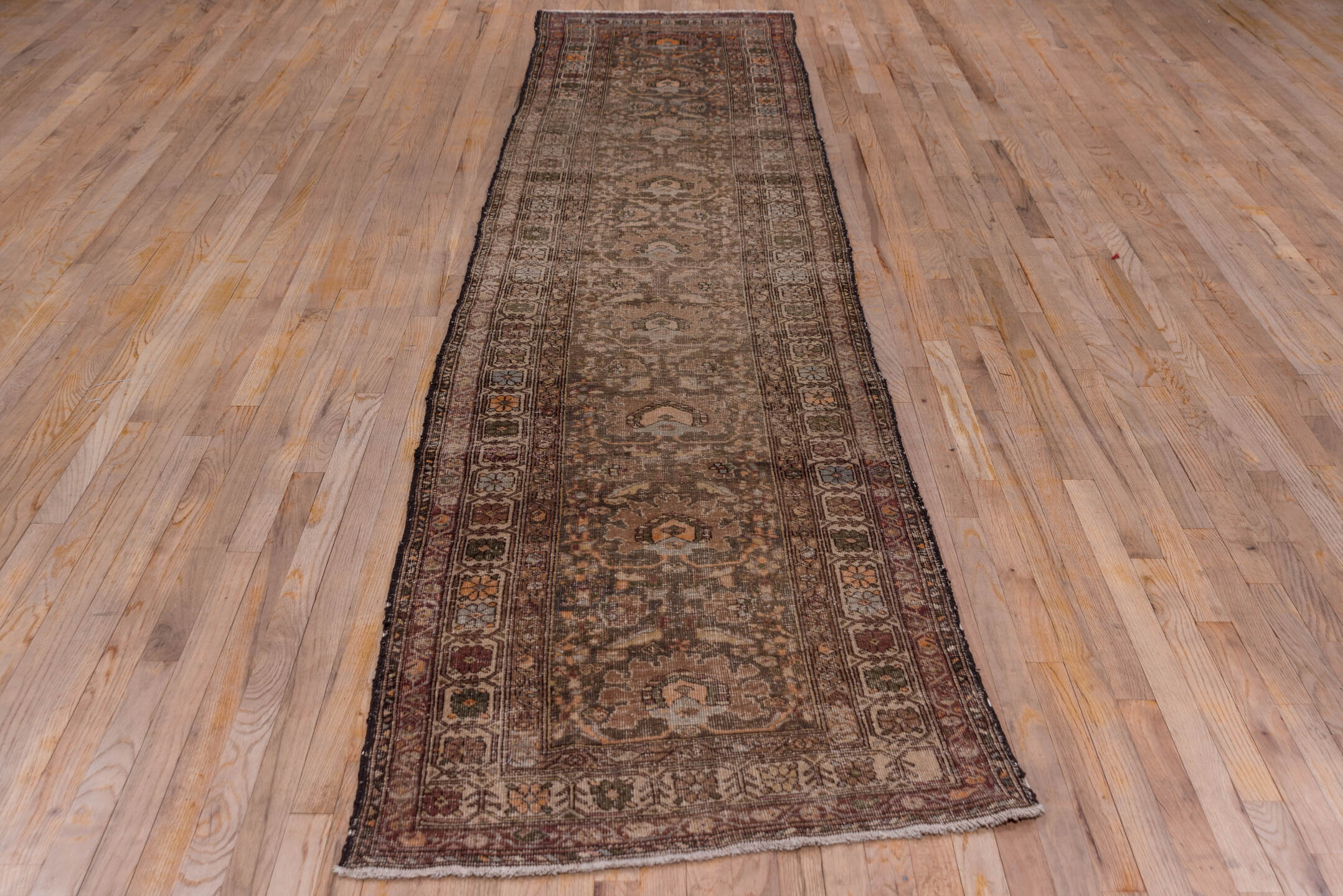 2' x 13' one-of-a-kind handmade vintage Sarab runner rug. Color palette: brown, dark gray, gray, pink, saddle brown