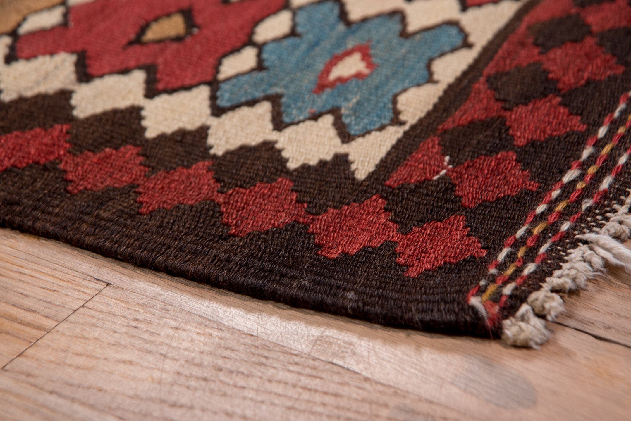 5' x 13' one-of-a-kind handmade antique Kilim rug. Color palette: rust, ivory, indigo, camel, charcoal, sky blue, burgundy