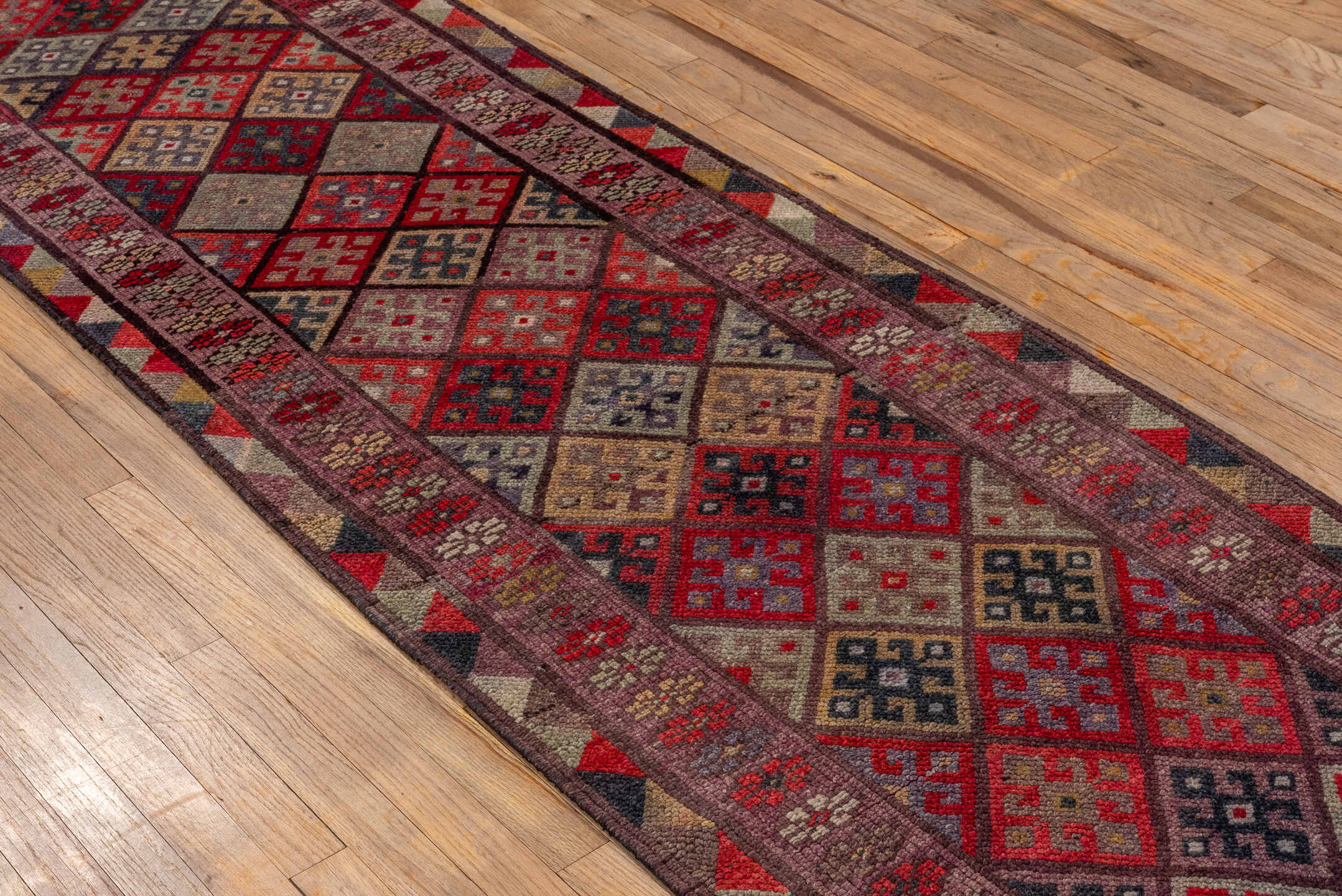 2' x 10' one-of-a-kind handmade vintage Oushak runner rug. Color palette: brown, burgundy, gray, pink, red, redwood