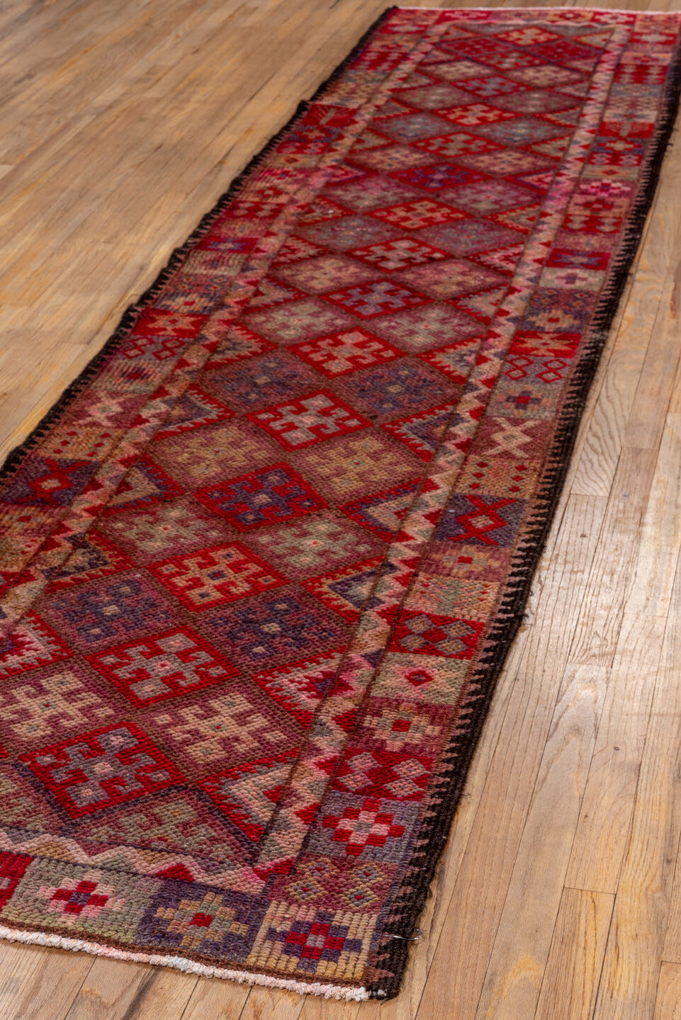 2' x 11' one-of-a-kind handmade vintage Oushak runner rug. Color palette: rose, rust, taupe, burgundy, muted blue, ivory
