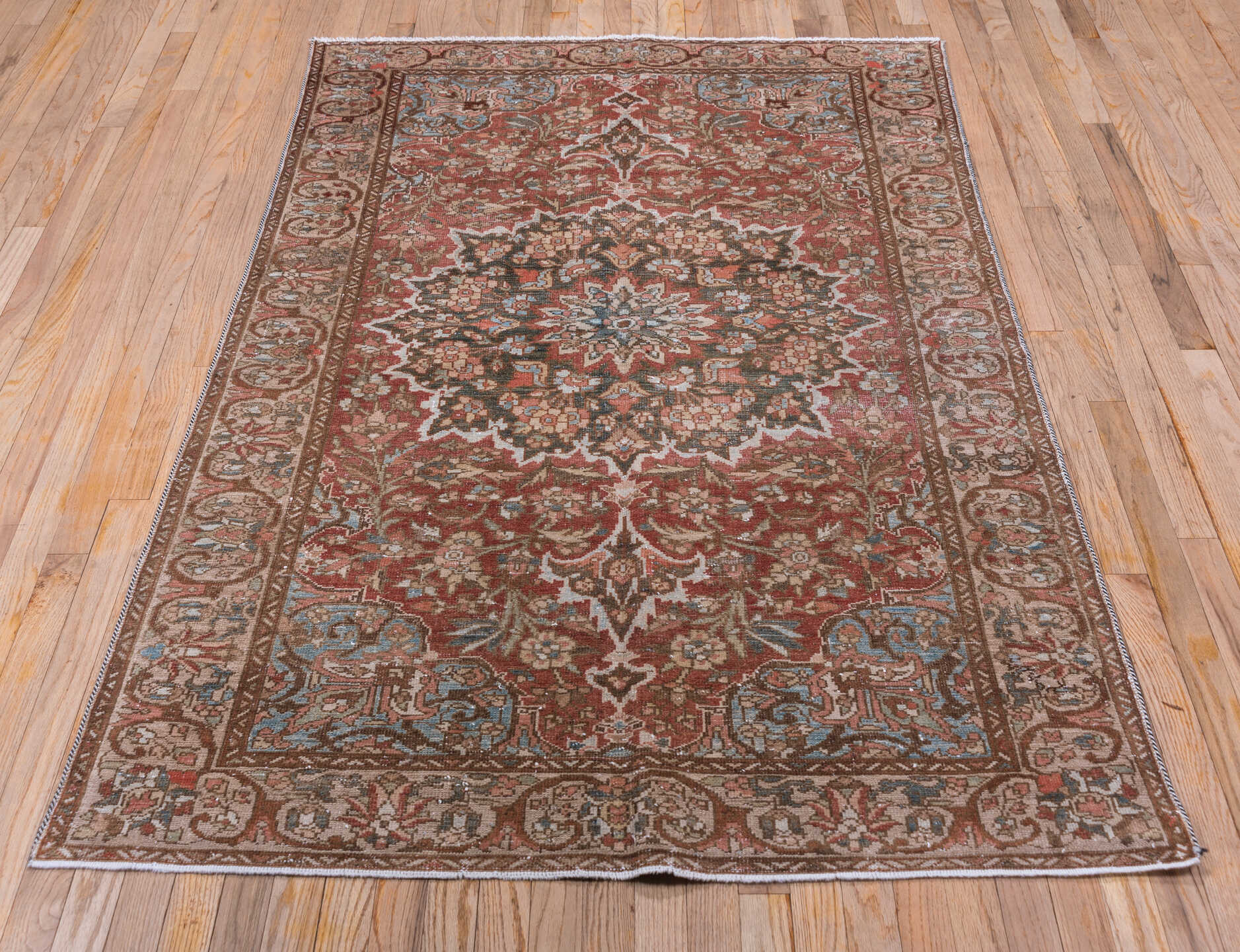 4' x 6' one-of-a-kind handmade vintage Baktiary small size rug. Color palette: rust, taupe, ivory, sky blue, brown, rose
