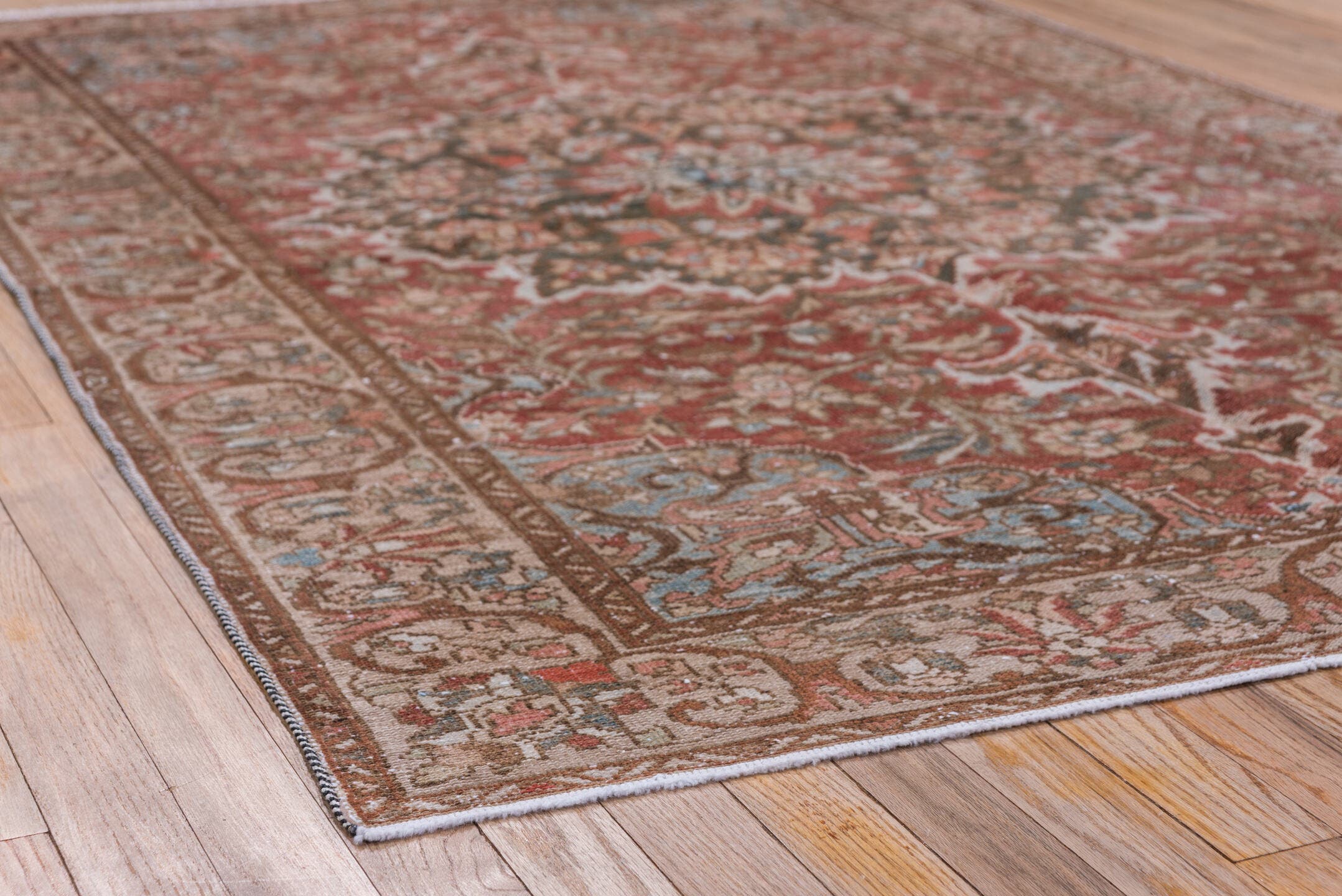 4' x 6' one-of-a-kind handmade vintage Baktiary small size rug. Color palette: rust, taupe, ivory, sky blue, brown, rose