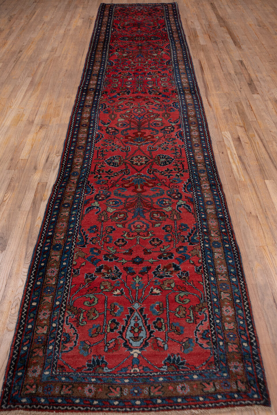 3' x 16' one-of-a-kind handmade vintage Lilian runner rug. Color palette: rust, navy, indigo, rose, ivory, charcoal