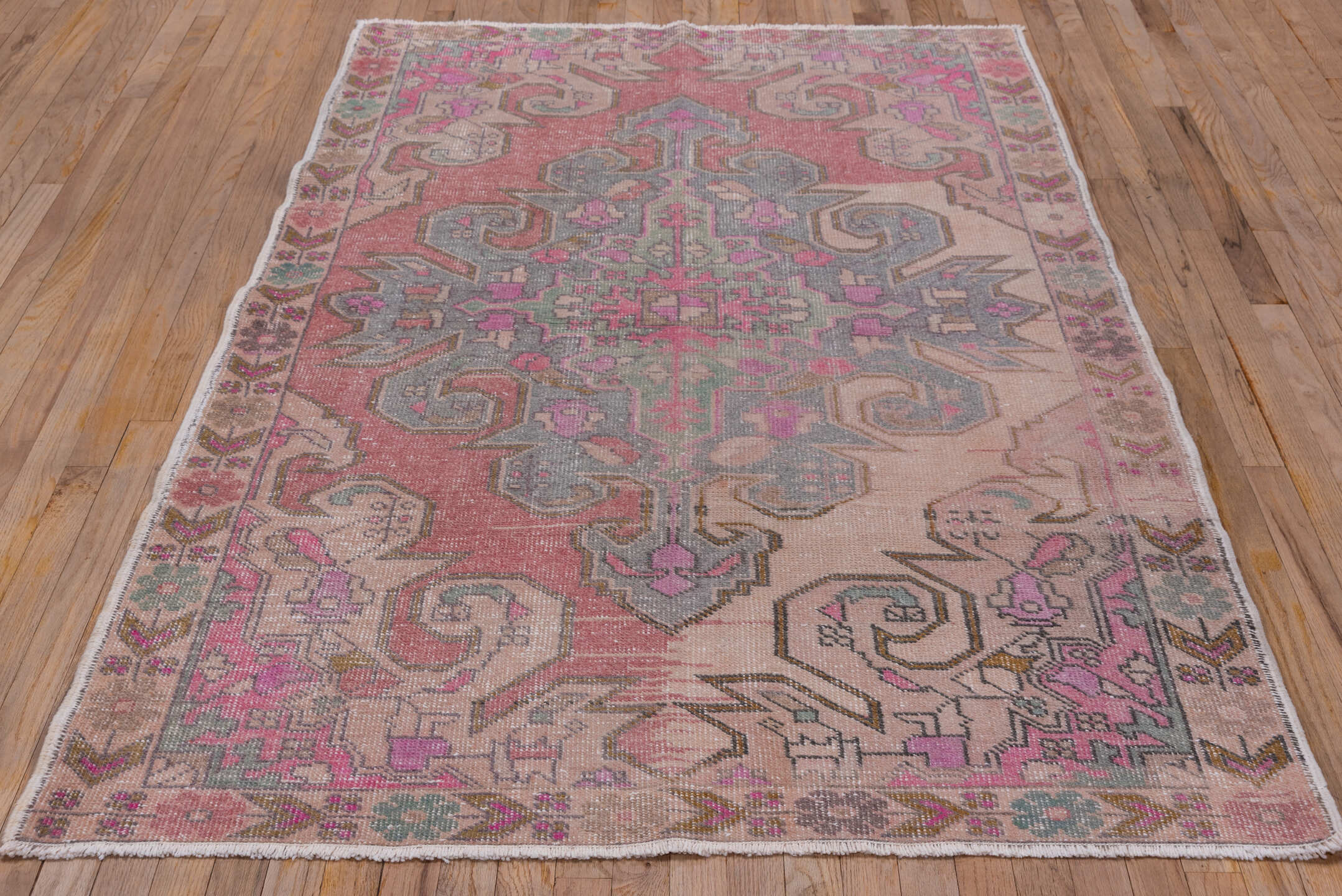 4' x 7' one-of-a-kind handmade vintage Oushak rug. Color palette: blush, ivory, dusty rose, pale blue, taupe, pink, sage