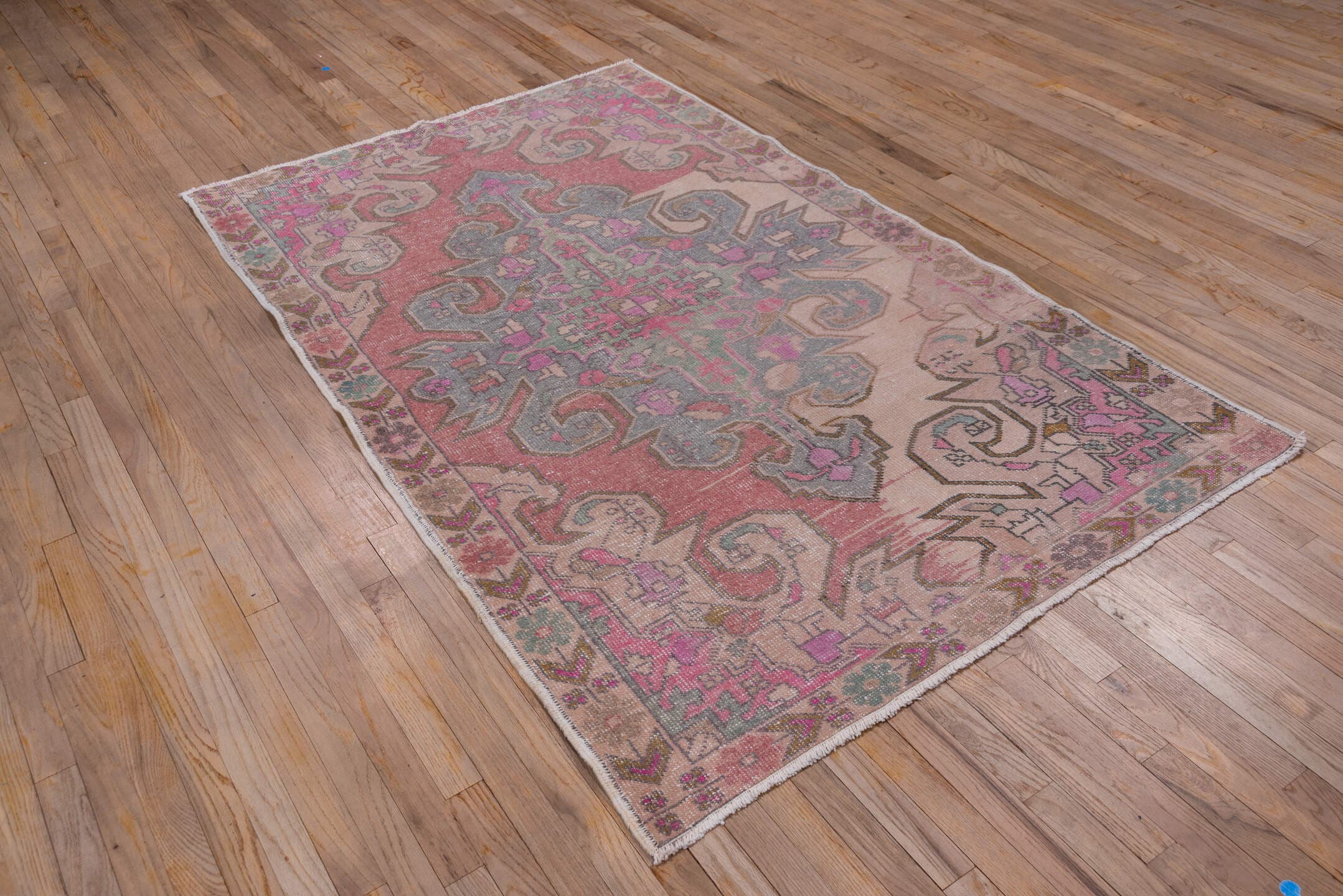 4' x 7' one-of-a-kind handmade vintage Oushak rug. Color palette: blush, ivory, dusty rose, pale blue, taupe, pink, sage