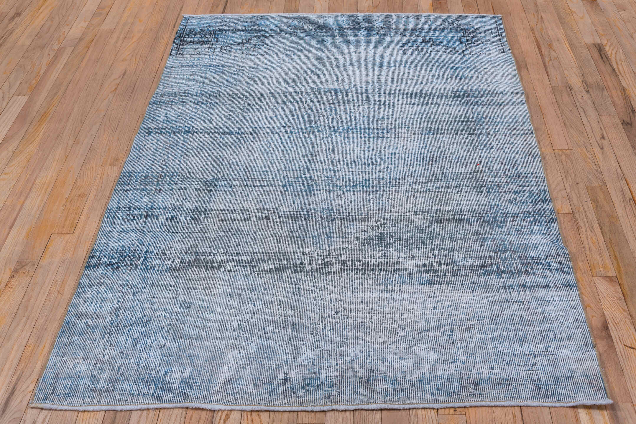 4' x 6' one-of-a-kind handmade vintage Overdyed small size rug. Color palette: pale blue, charcoal, slate, ivory, light blue